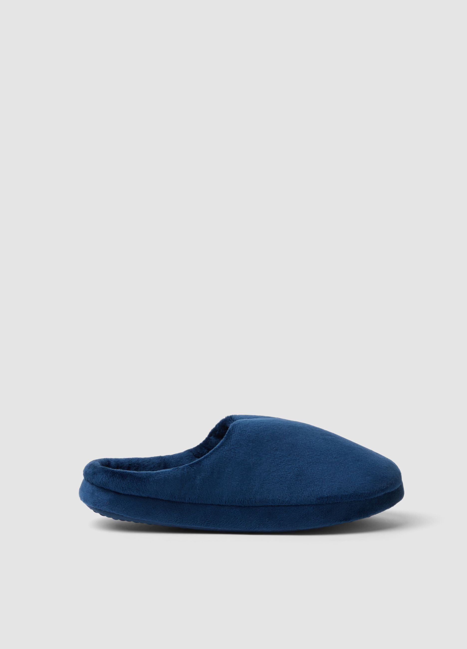 Blue closed-toe slippers with a soft-touch finish