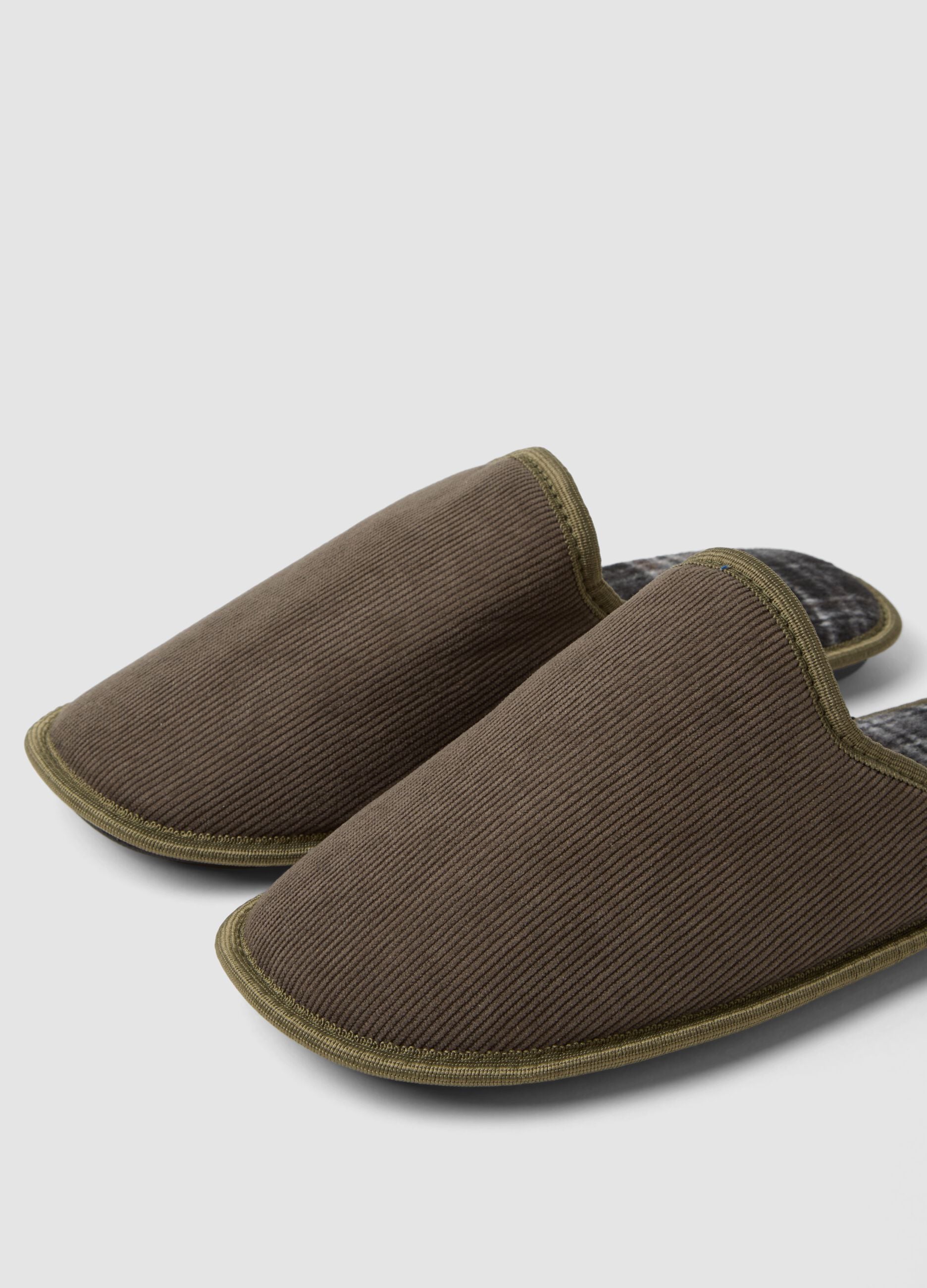 Brown slip-on house slippers with checked lining