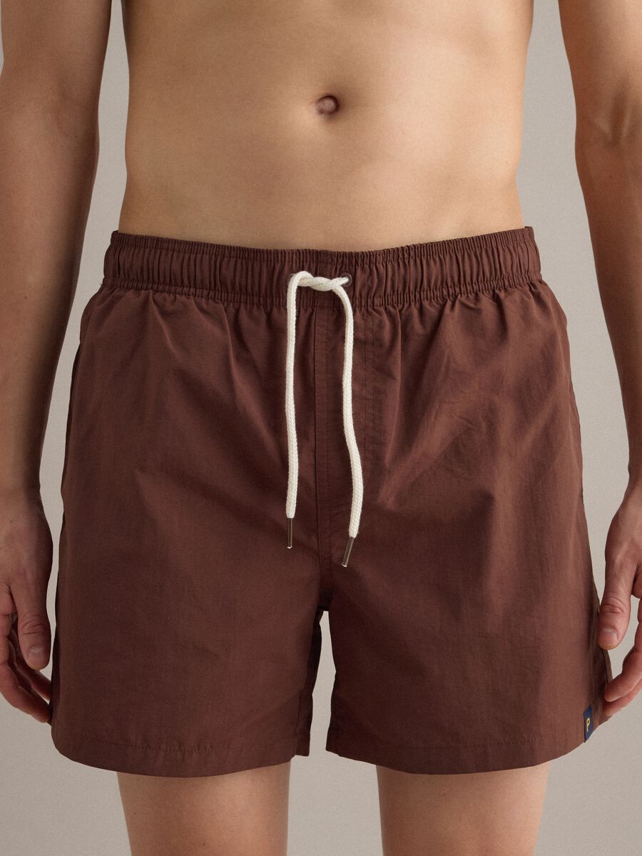 Brown swim shorts with elasticated waistband and drawstring_2