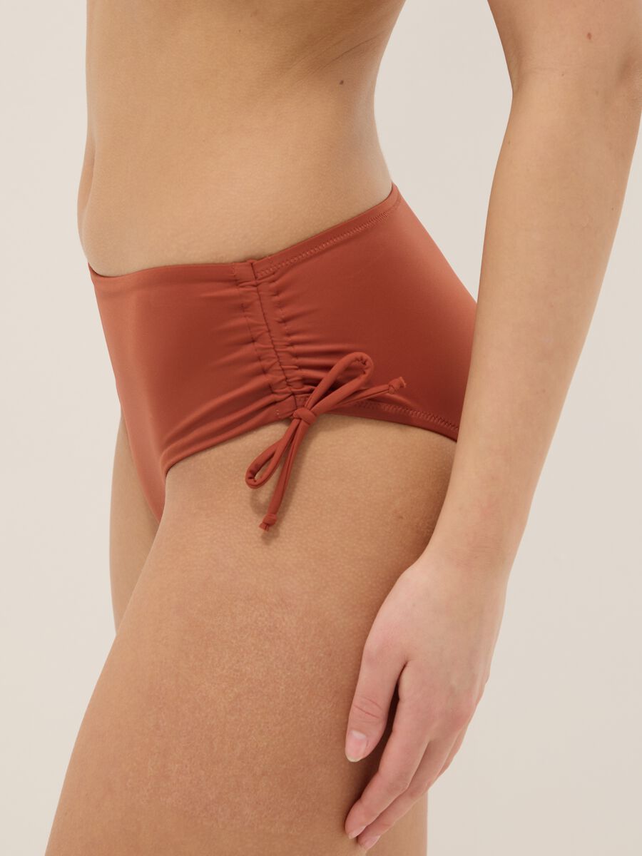 Orange stretch bikini bottoms with ruched side detailing_3