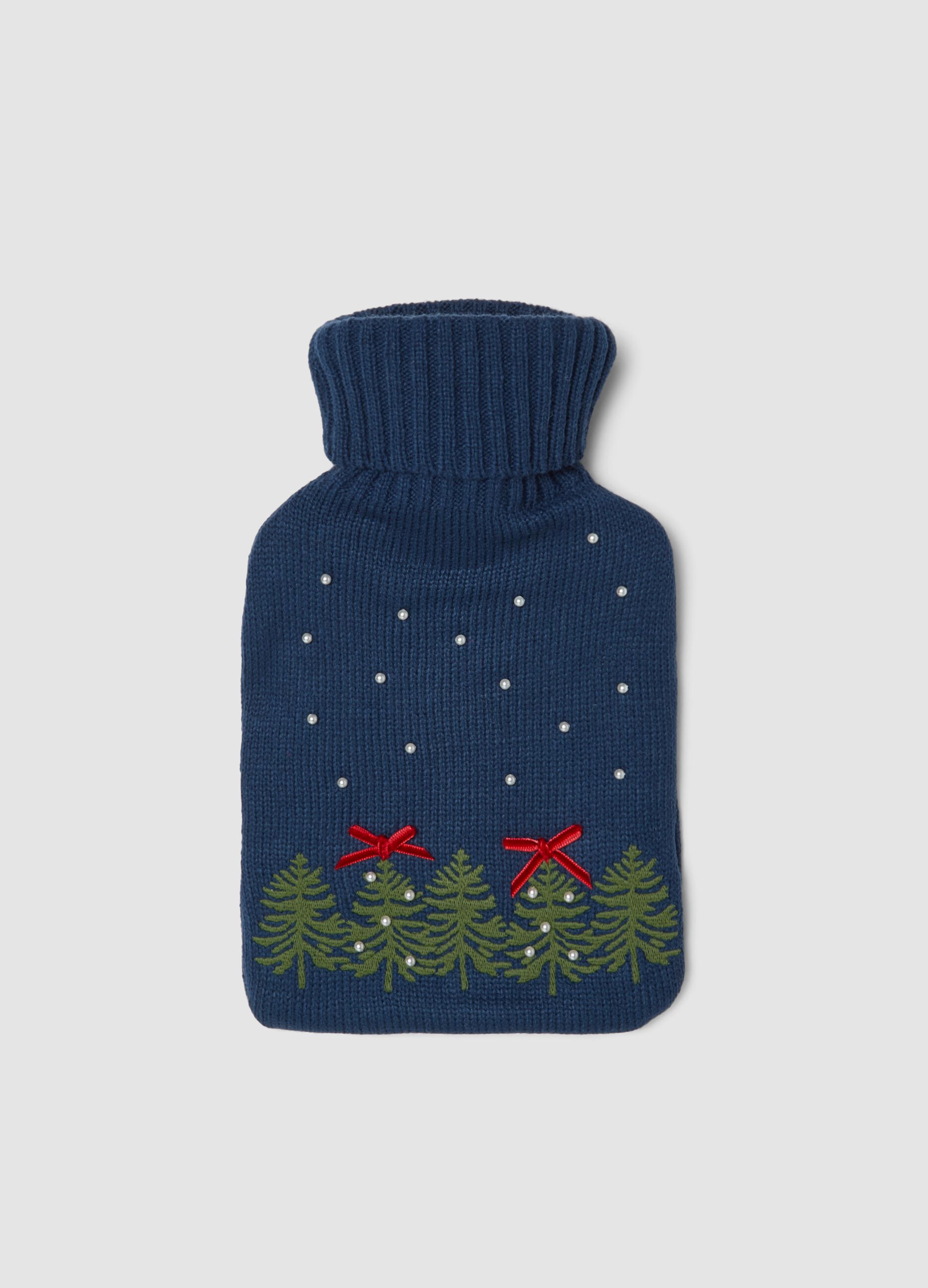 Blue hot water bottle with knitted cover