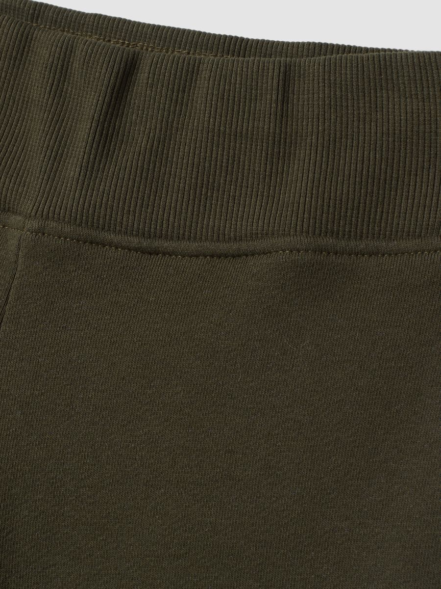 Pantaloni verdi flare in cotone elasticizzato_1