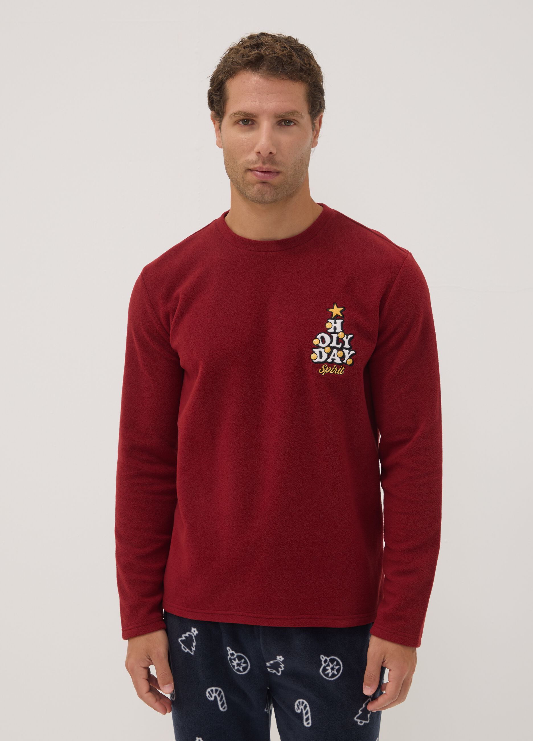 Long red pyjama set with crew neck top and patterned trousers
