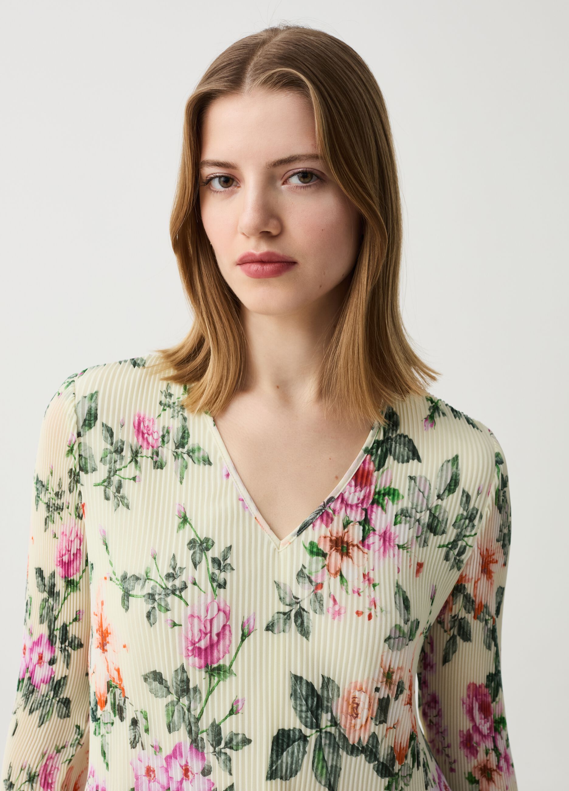Pleated blouse with floral print