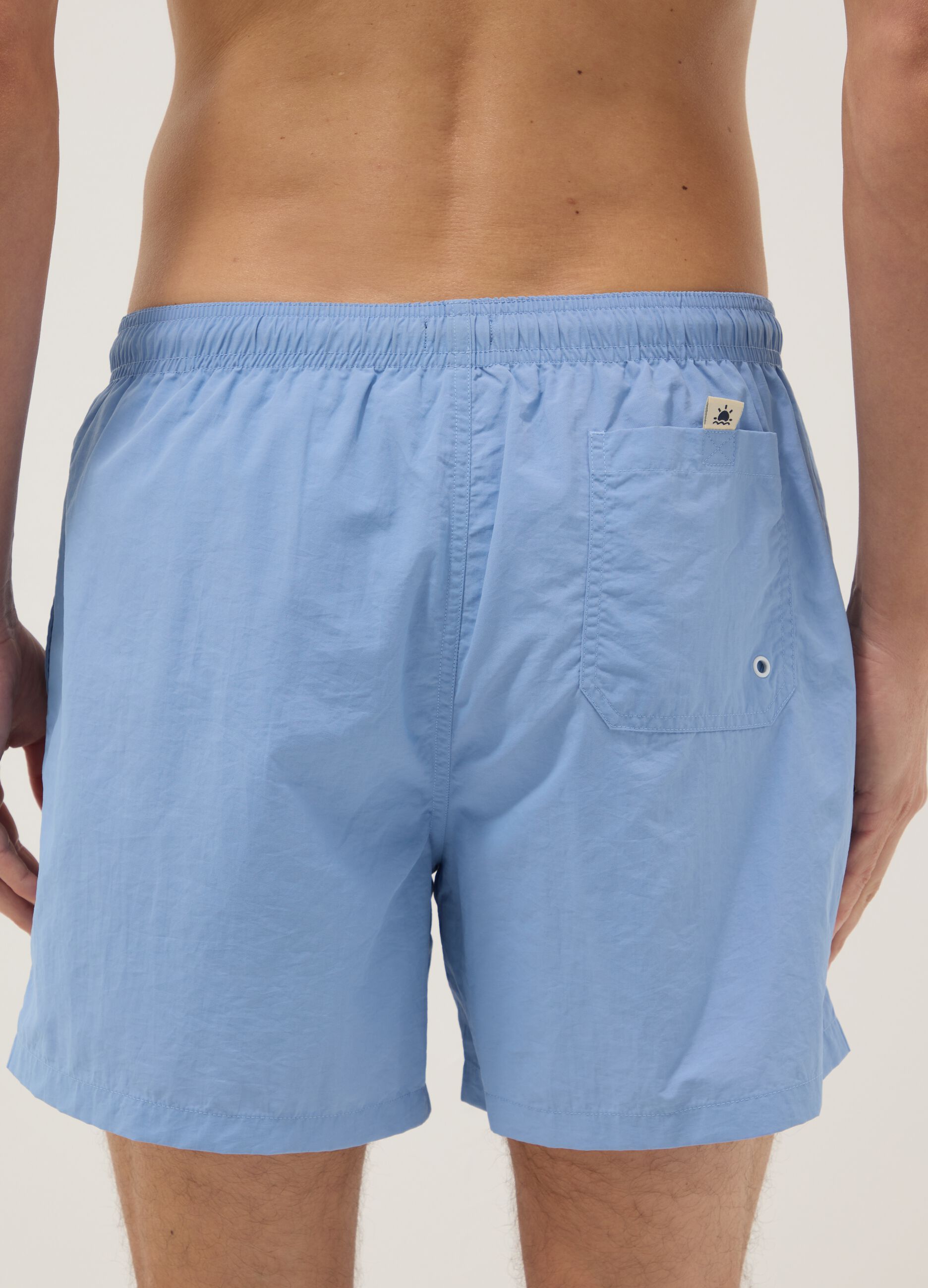 Blue swim shorts with elasticated waist