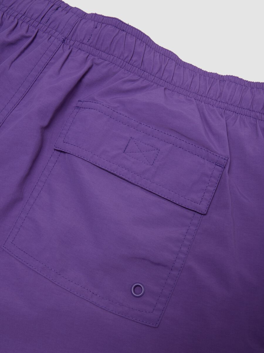 Purple swim shorts with elasticated waistband and drawstring_1