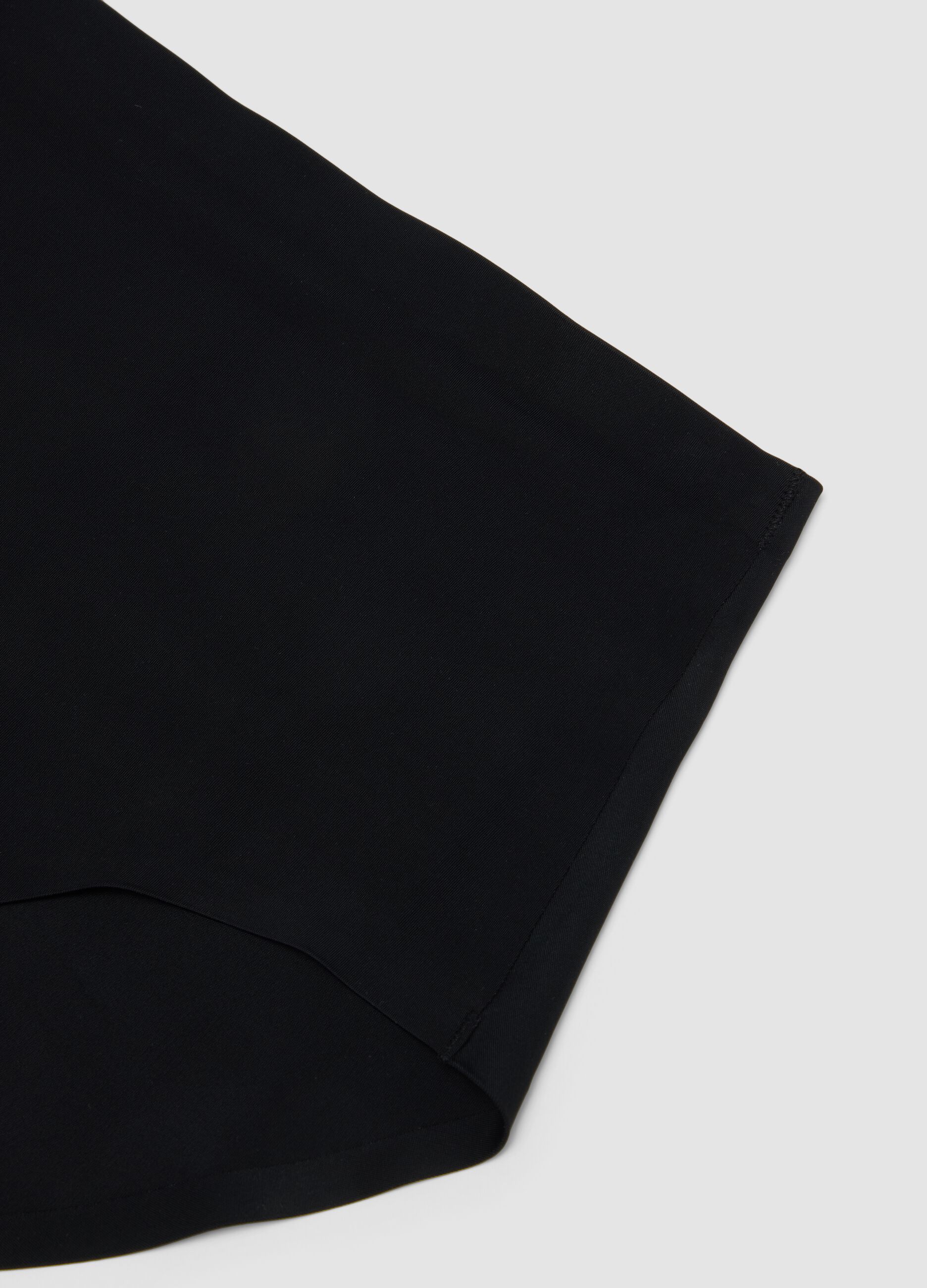 Black high-waisted Brazilian briefs in stretch fabric with a shaping effect