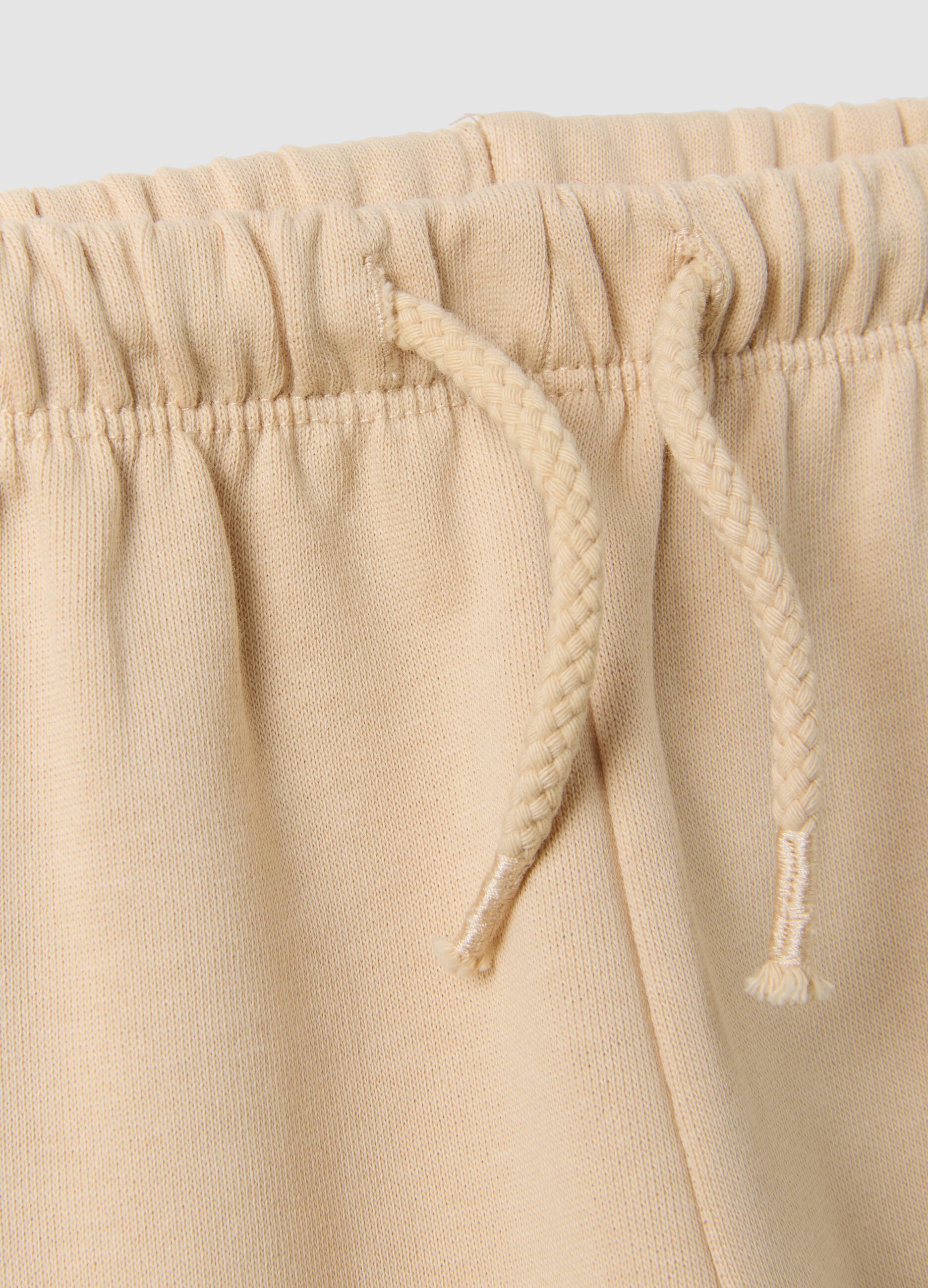 Beige pure cotton trousers with elasticated waist and print for baby girl