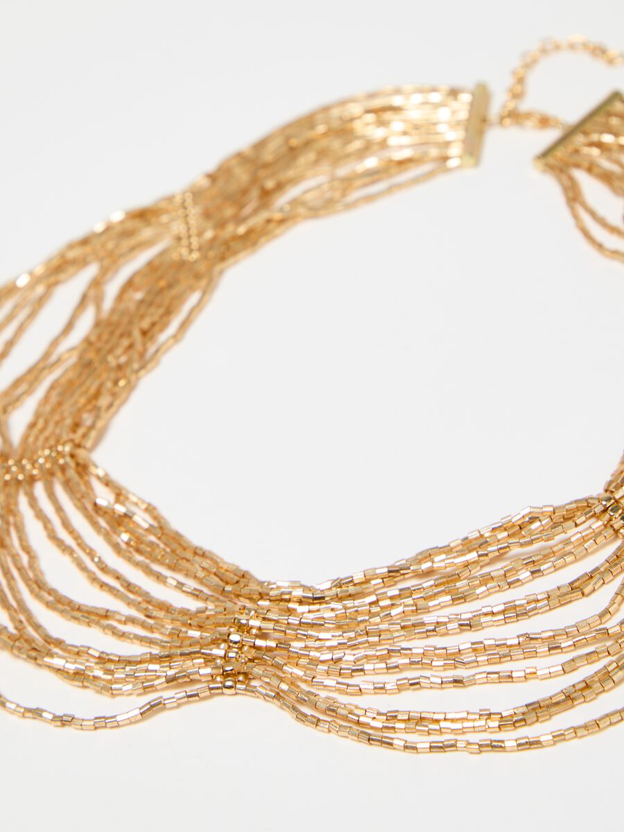 Multi-string necklace with golden beads_1