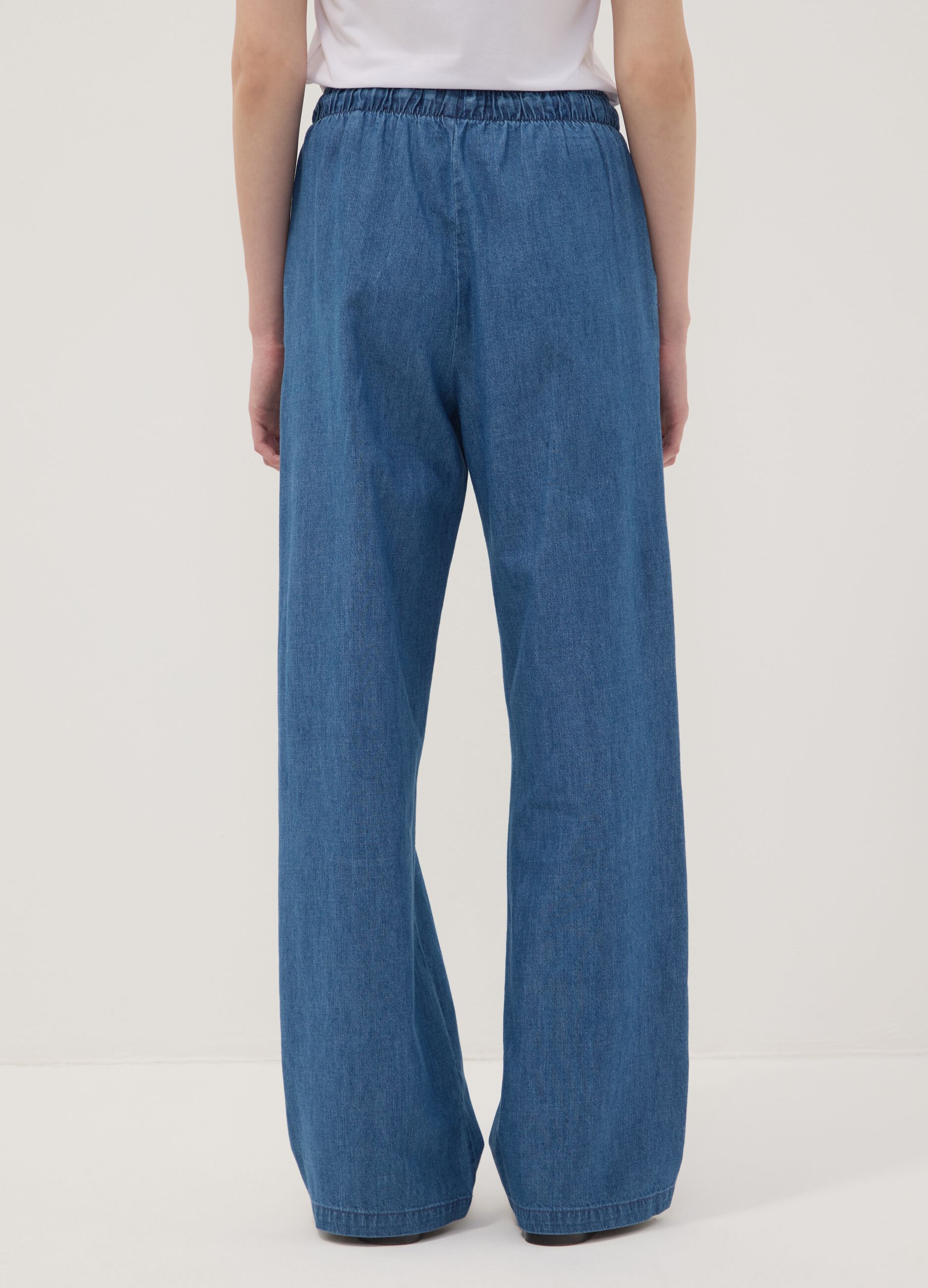 Pantaloni denim blu in puro cotone wide leg con coulisse