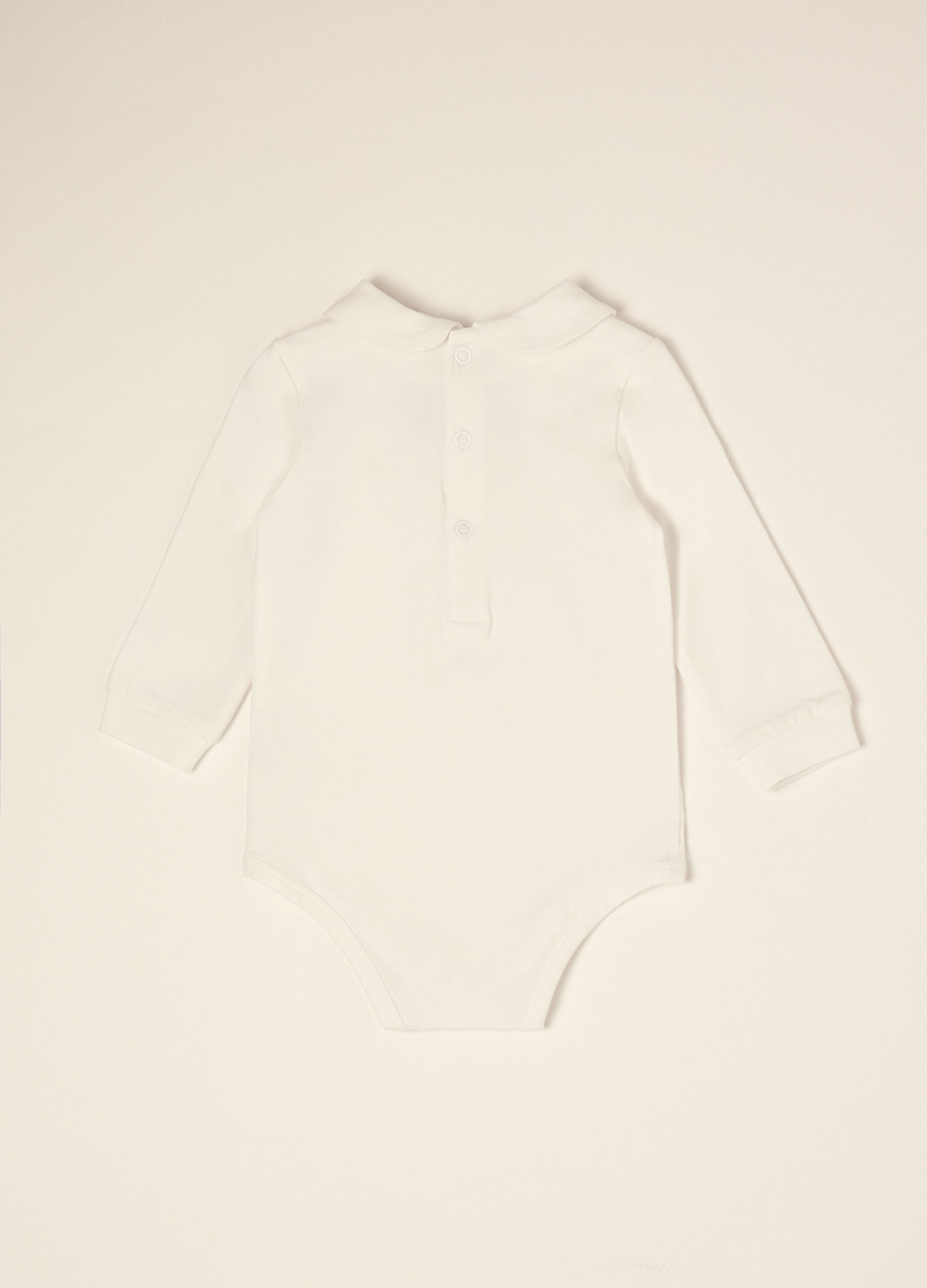 Body branco de beb&eacute; em algod&atilde;o org&acirc;nico el&aacute;stico com la&ccedil;o