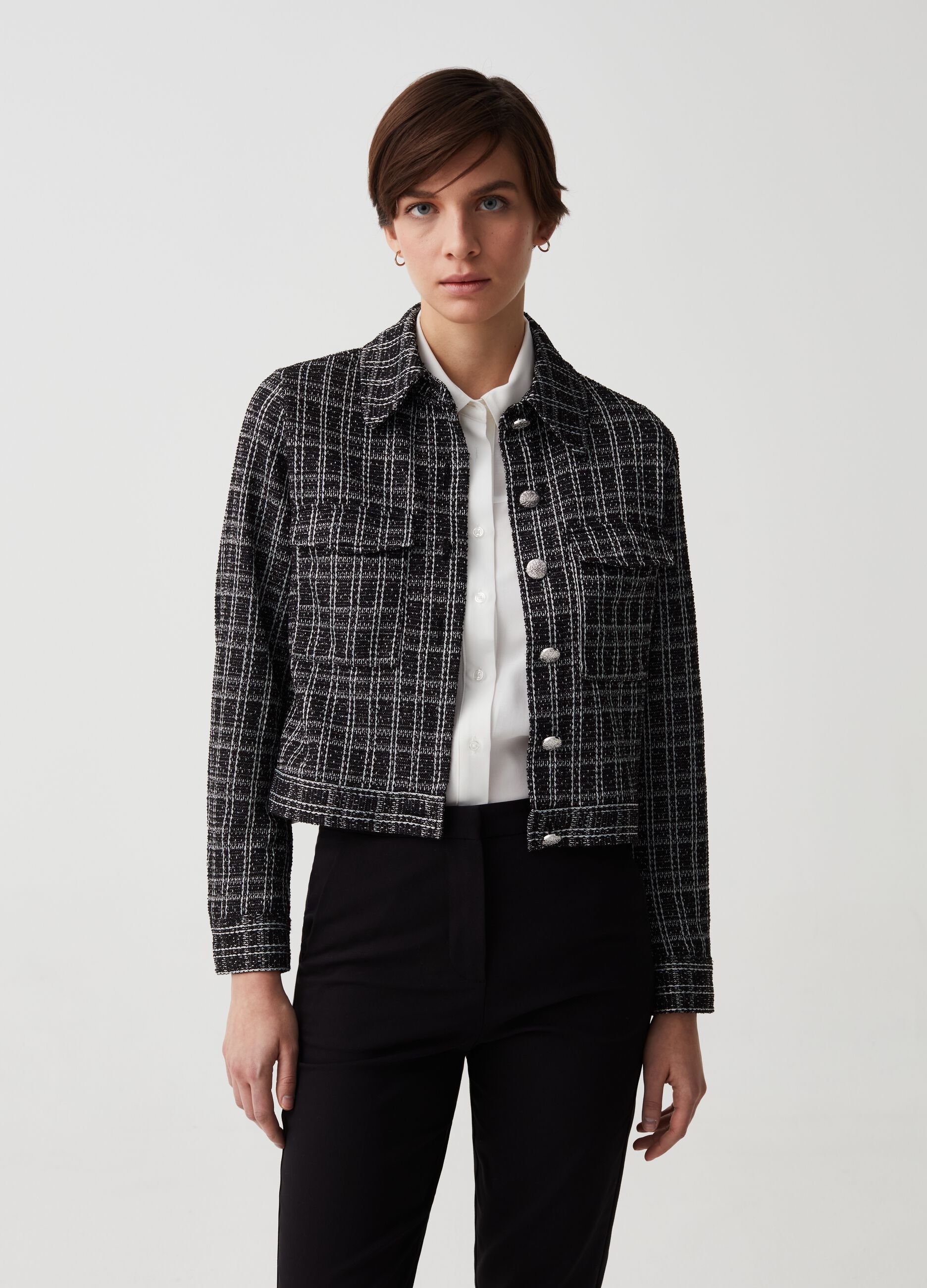 Short jacket in lurex with decorated buttons