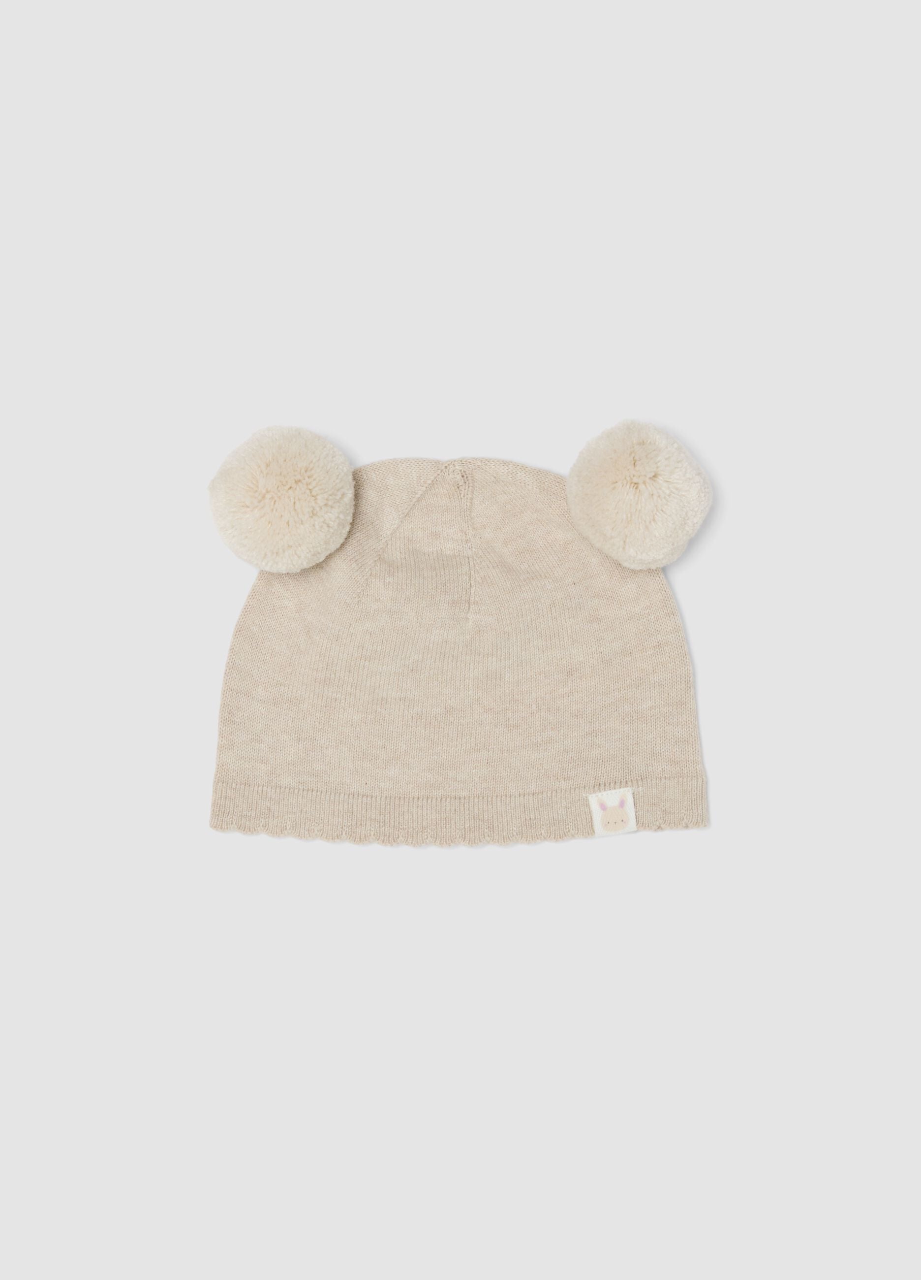 Beige Strickm&uuml;tze aus reiner Bio-Baumwolle mit Pompons f&uuml;r Baby-M&auml;dchen