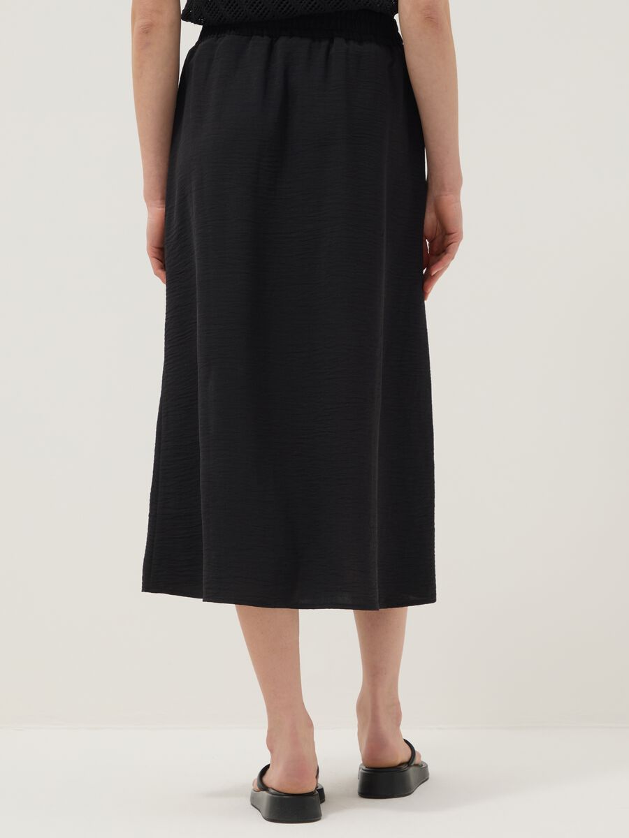Black long skirt with regular fit, elasticated waist and slit_2