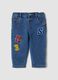 Blue stretch cotton jeans with varsity-style appliqu&eacute;s for baby boy_0