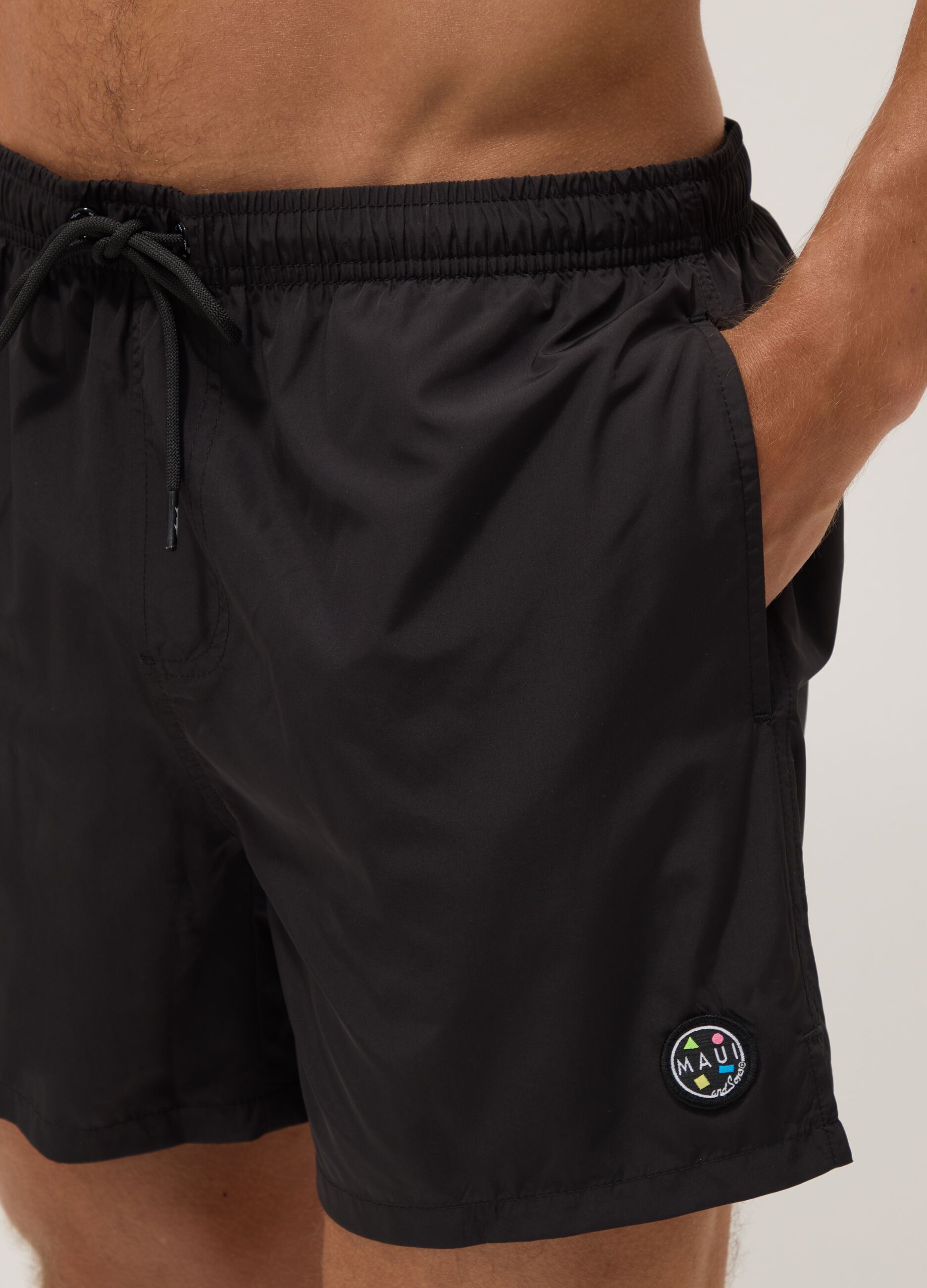 Black swim shorts with elasticated waistband