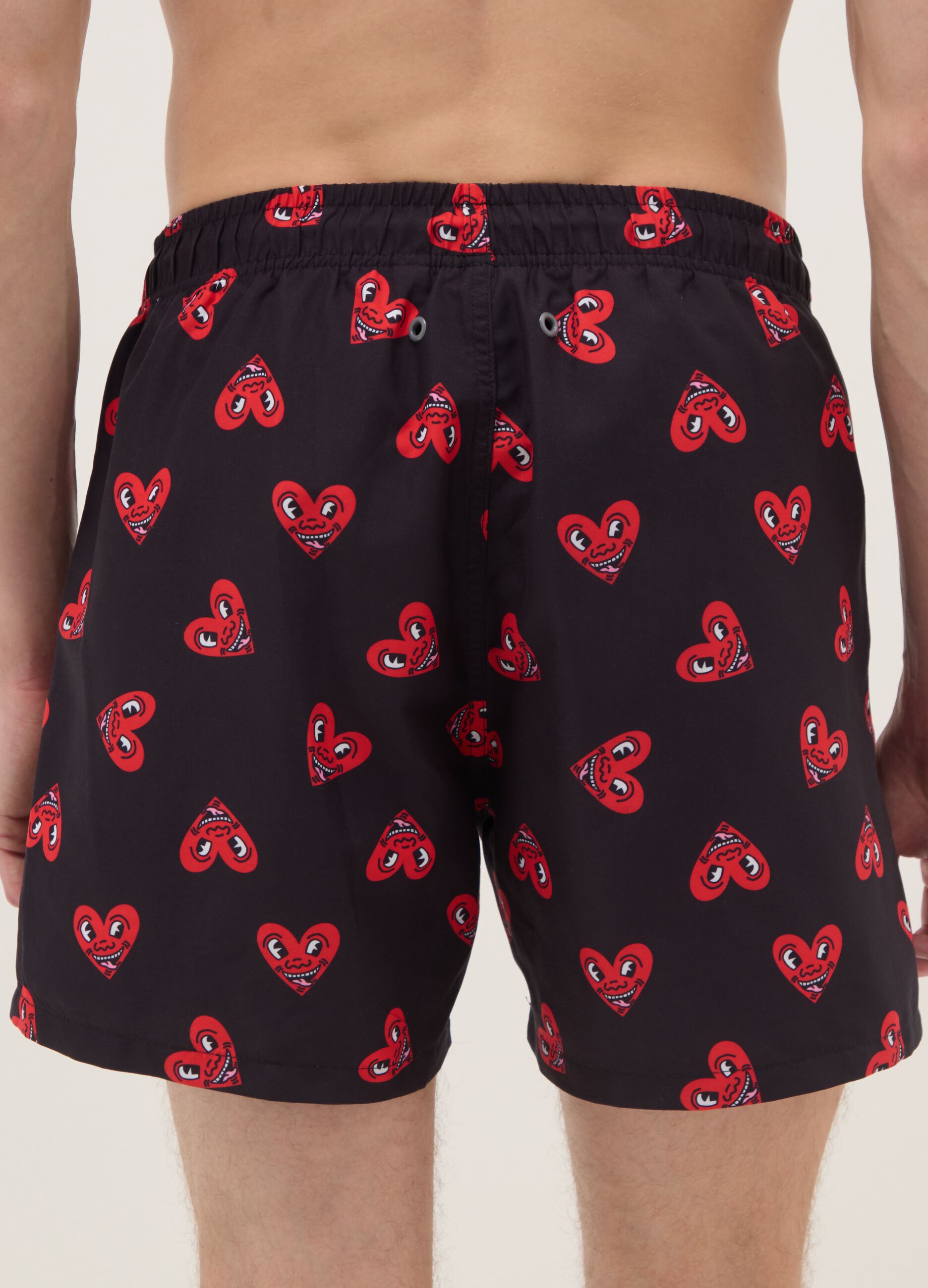 Black beach boxers with Keith Haring heart prints