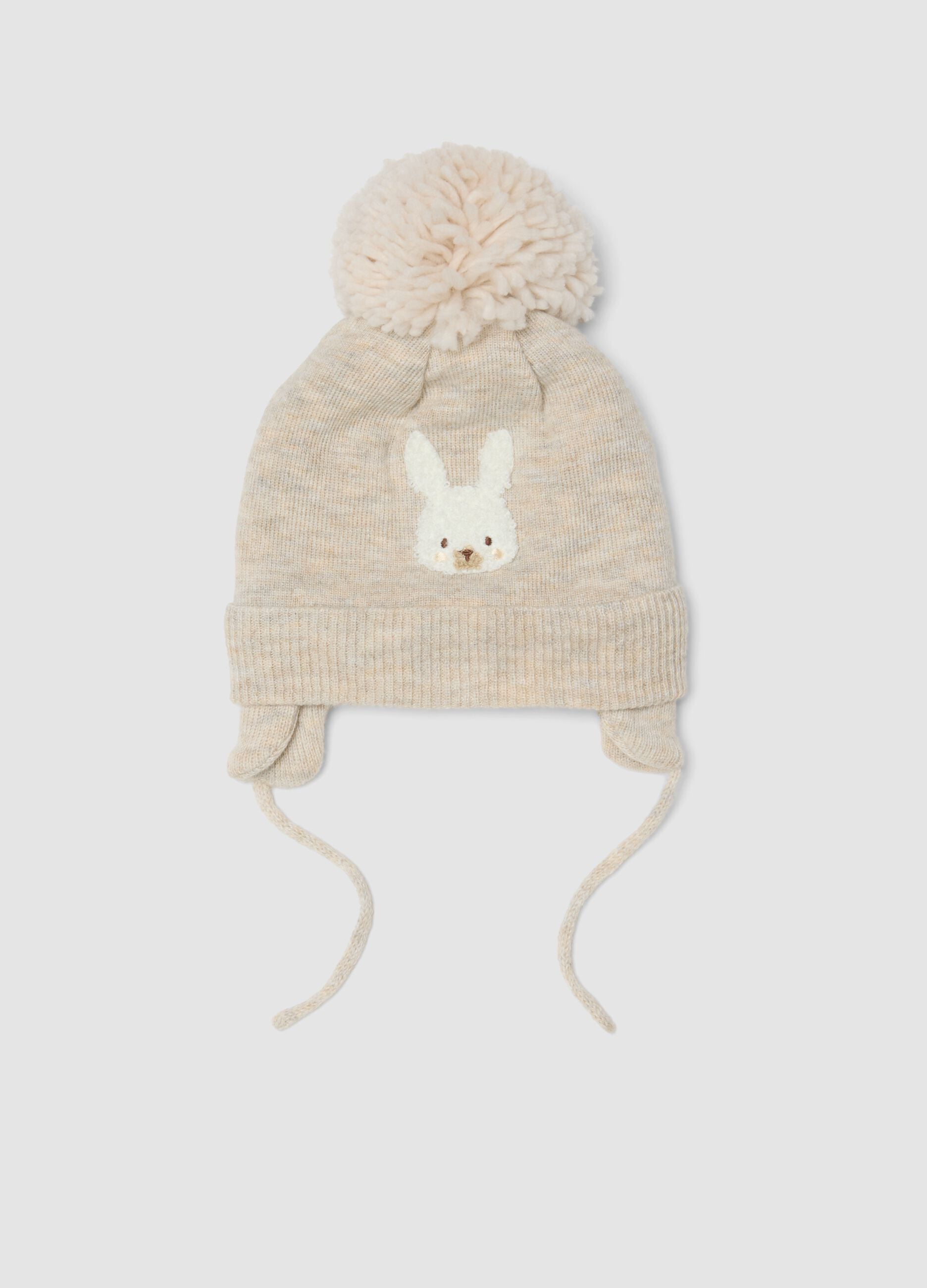Cappello beige melange in misto lana con pompon
