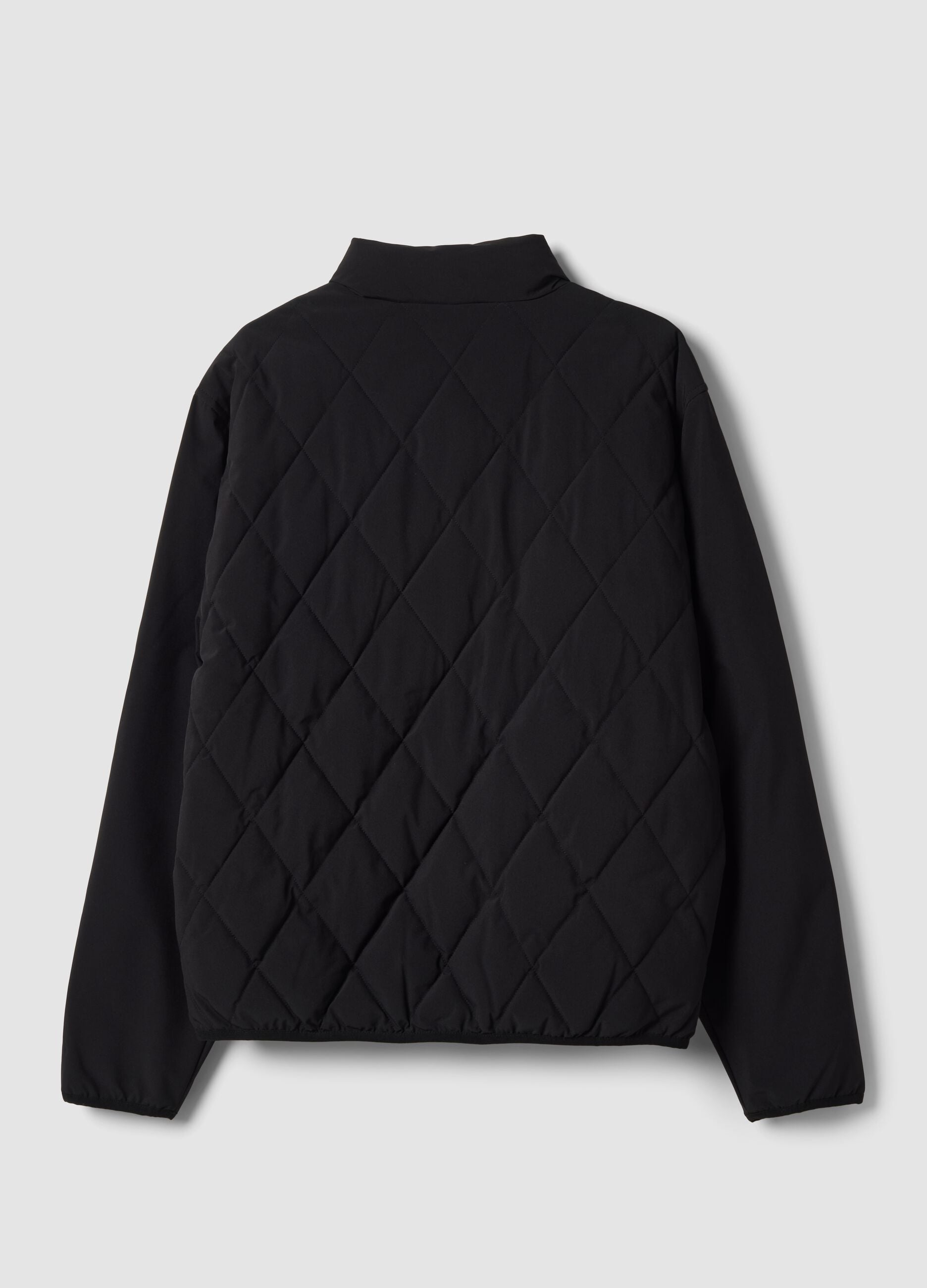 Giacca nera in tessuto elasticizzato con zip