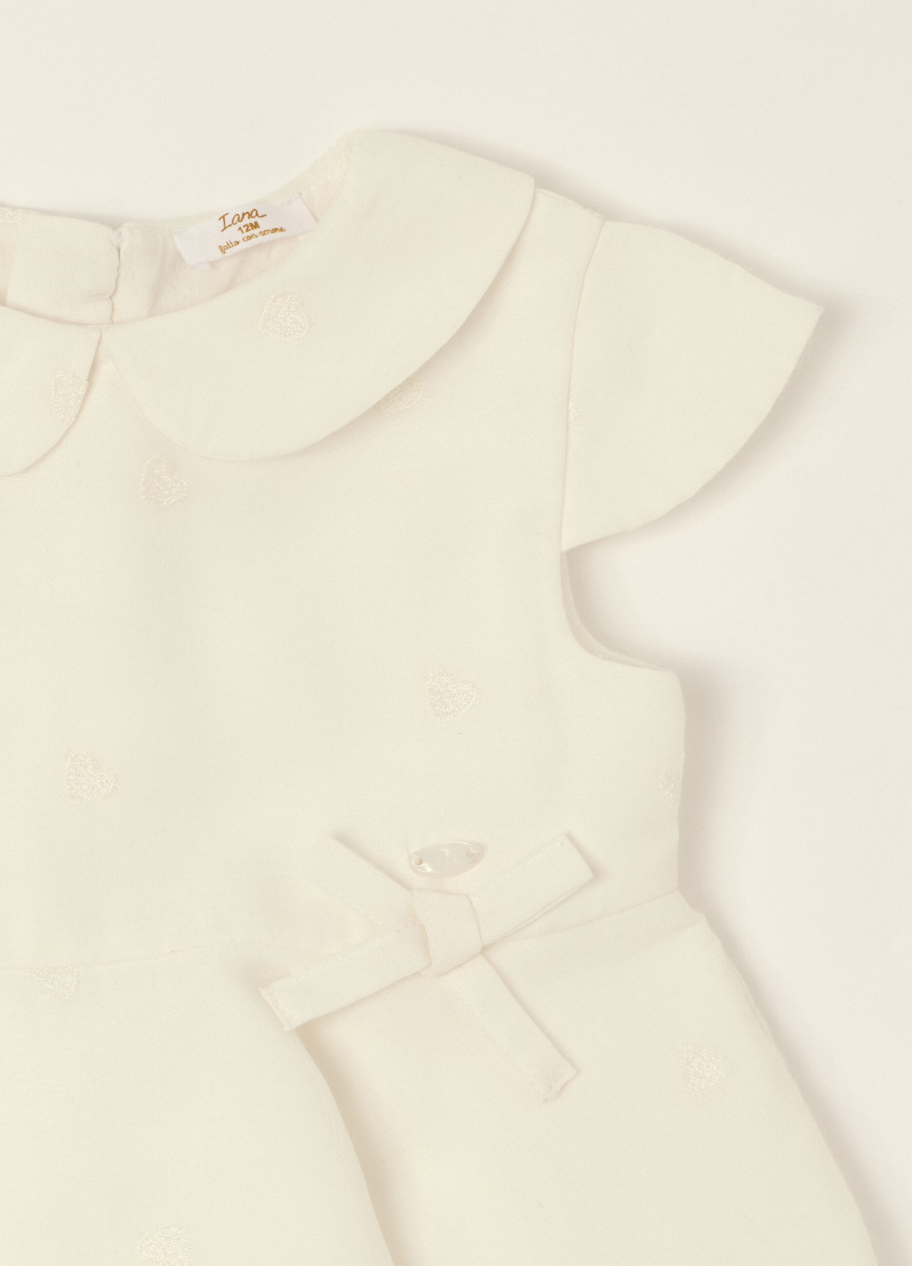 White dress with embroidered details