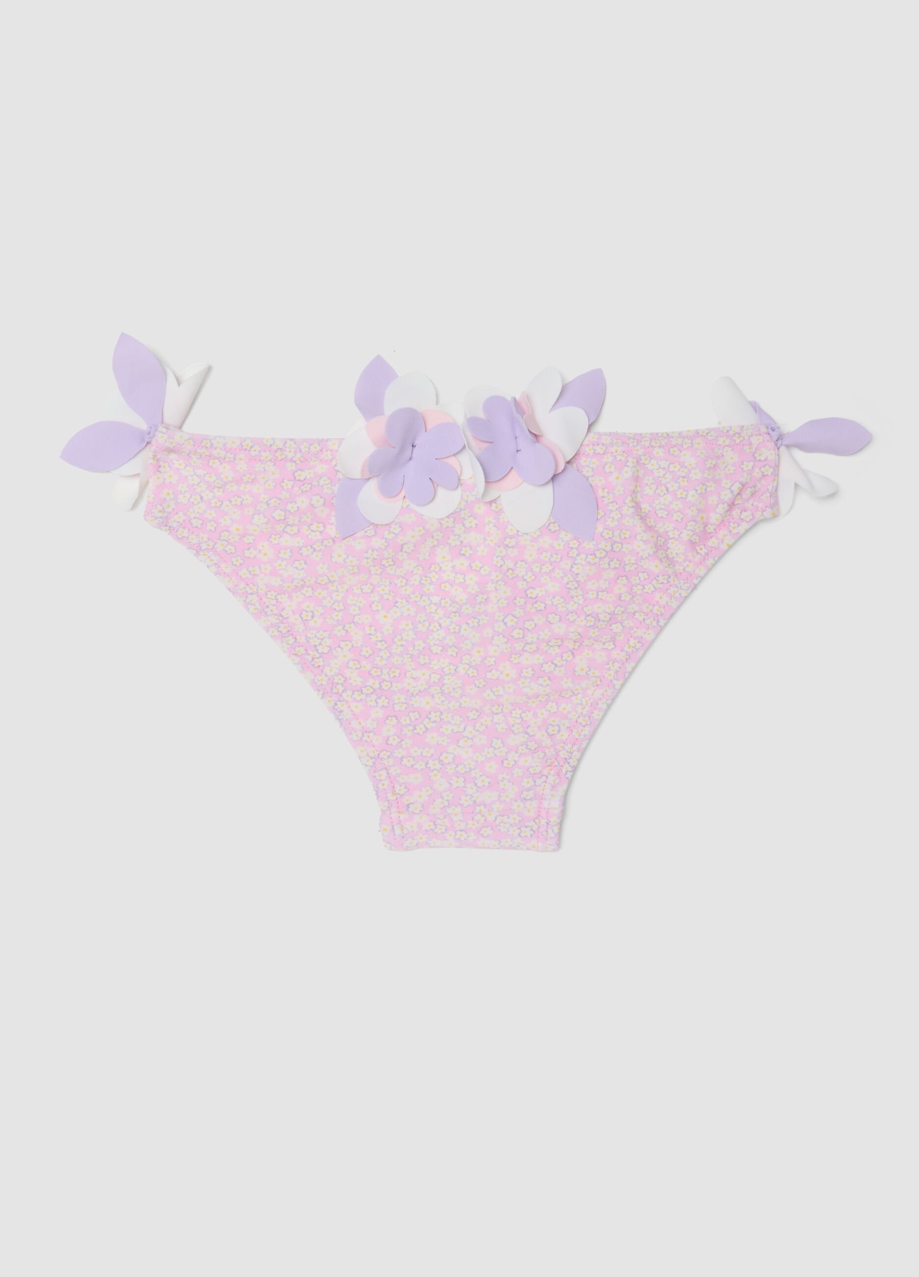 Pink stretch swim briefs with applied floral details