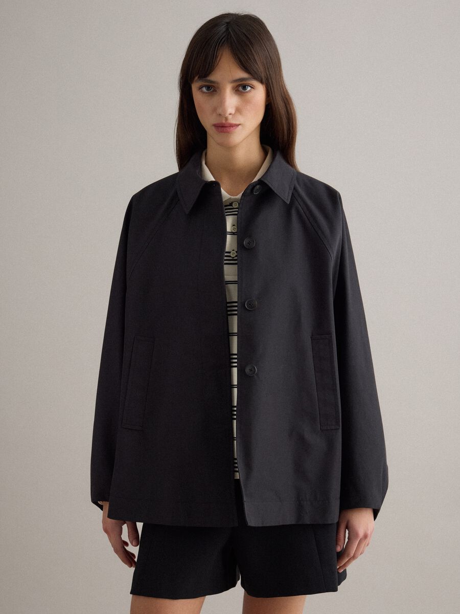 Black oversized cotton blend jacket with hidden closure_1
