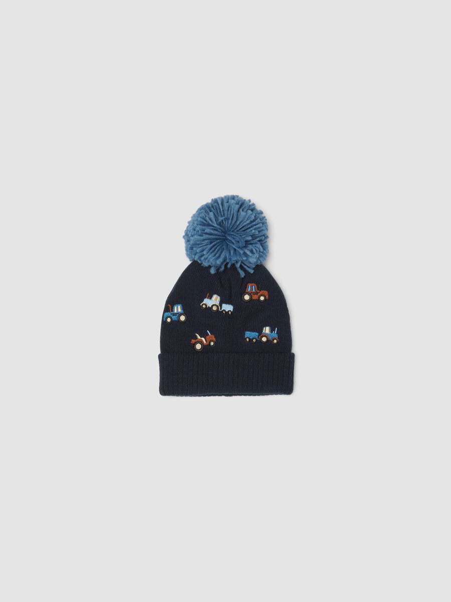 Blue knitted hat with pompom and tractor embroidery_0