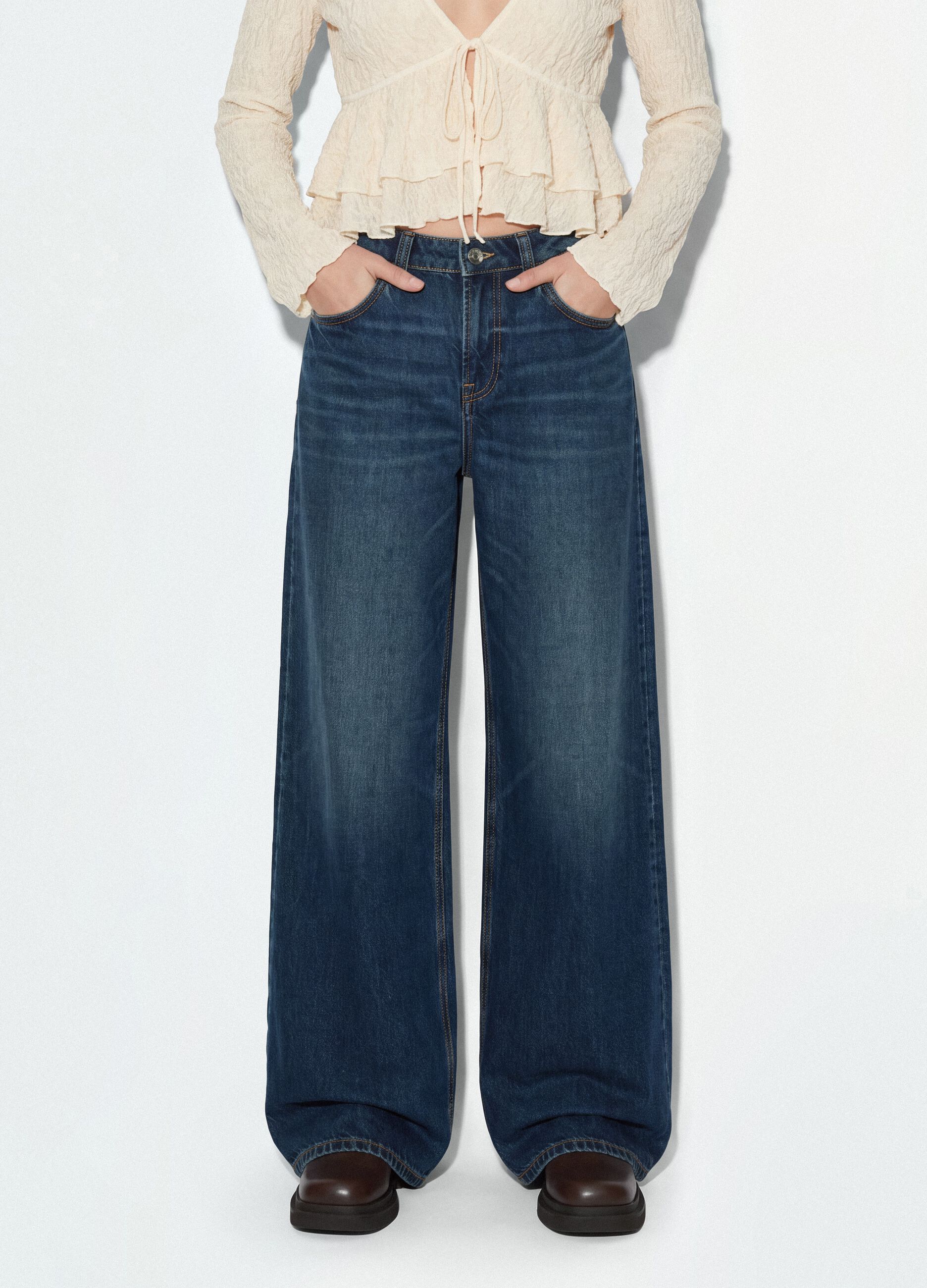 Blue denim jeans in 100% cotton with super wide-leg fit