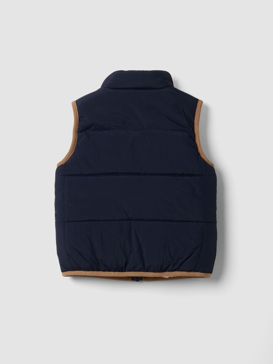 Blue padded gilet with zip and contrast trims_1