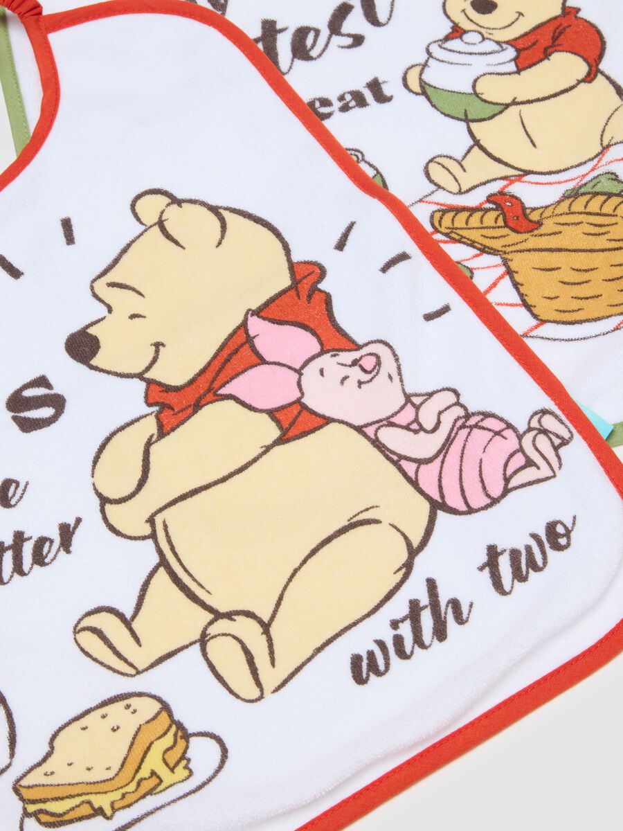 Twin-pack of white cotton mix bibs for newborn girls with Winnie the Pooh_1