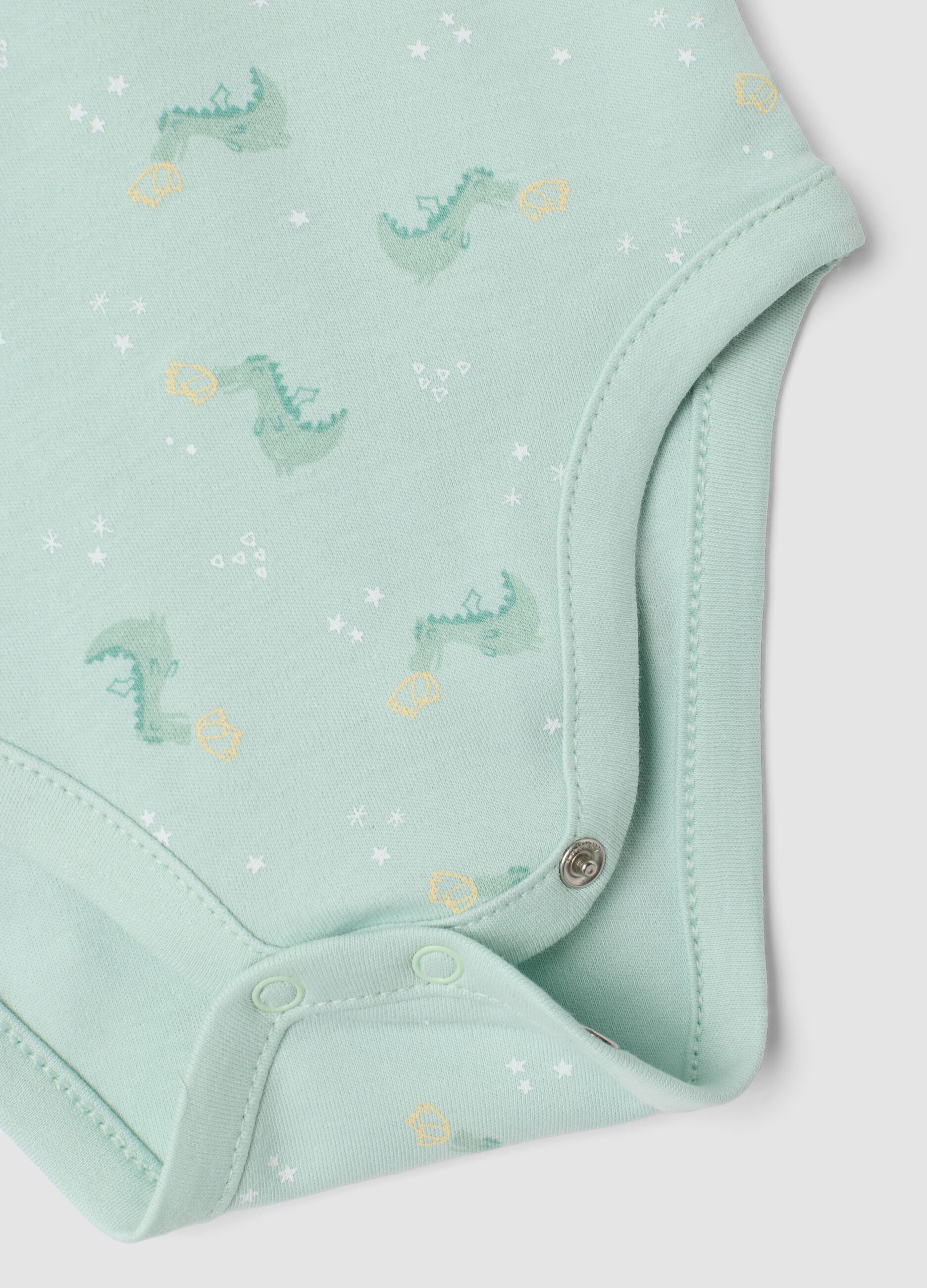 3-pack of green and white organic cotton baby bodysuits