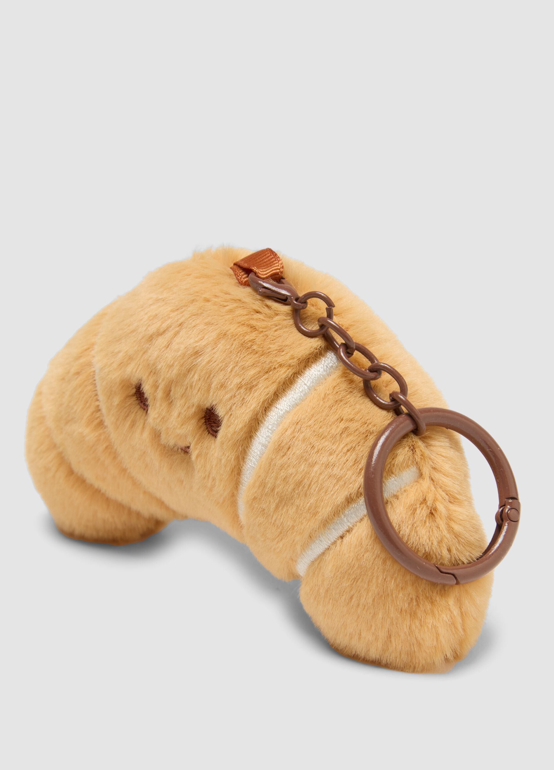 Brown croissant-shaped keyring