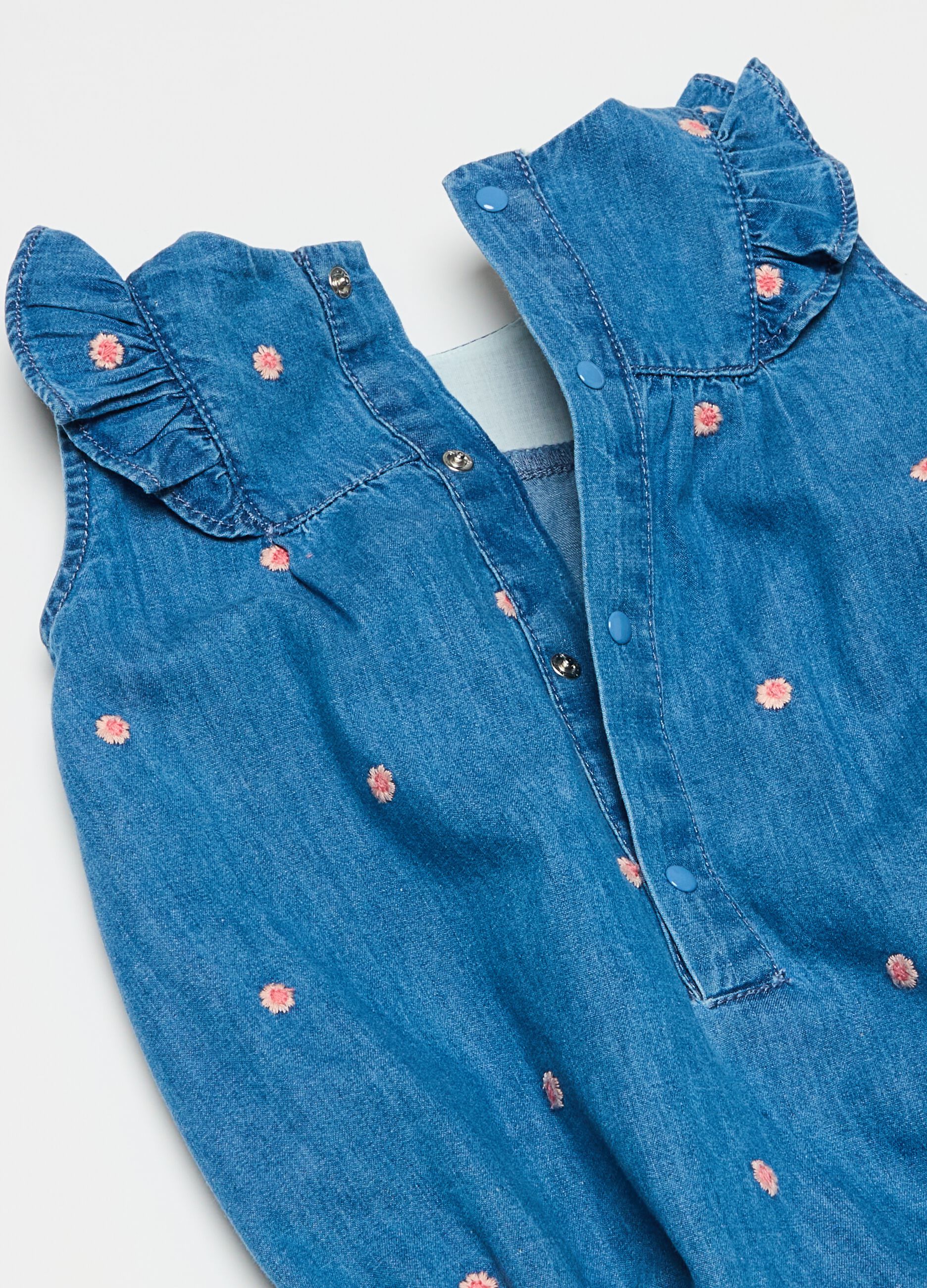 Denim romper suit with small flowers embroidery