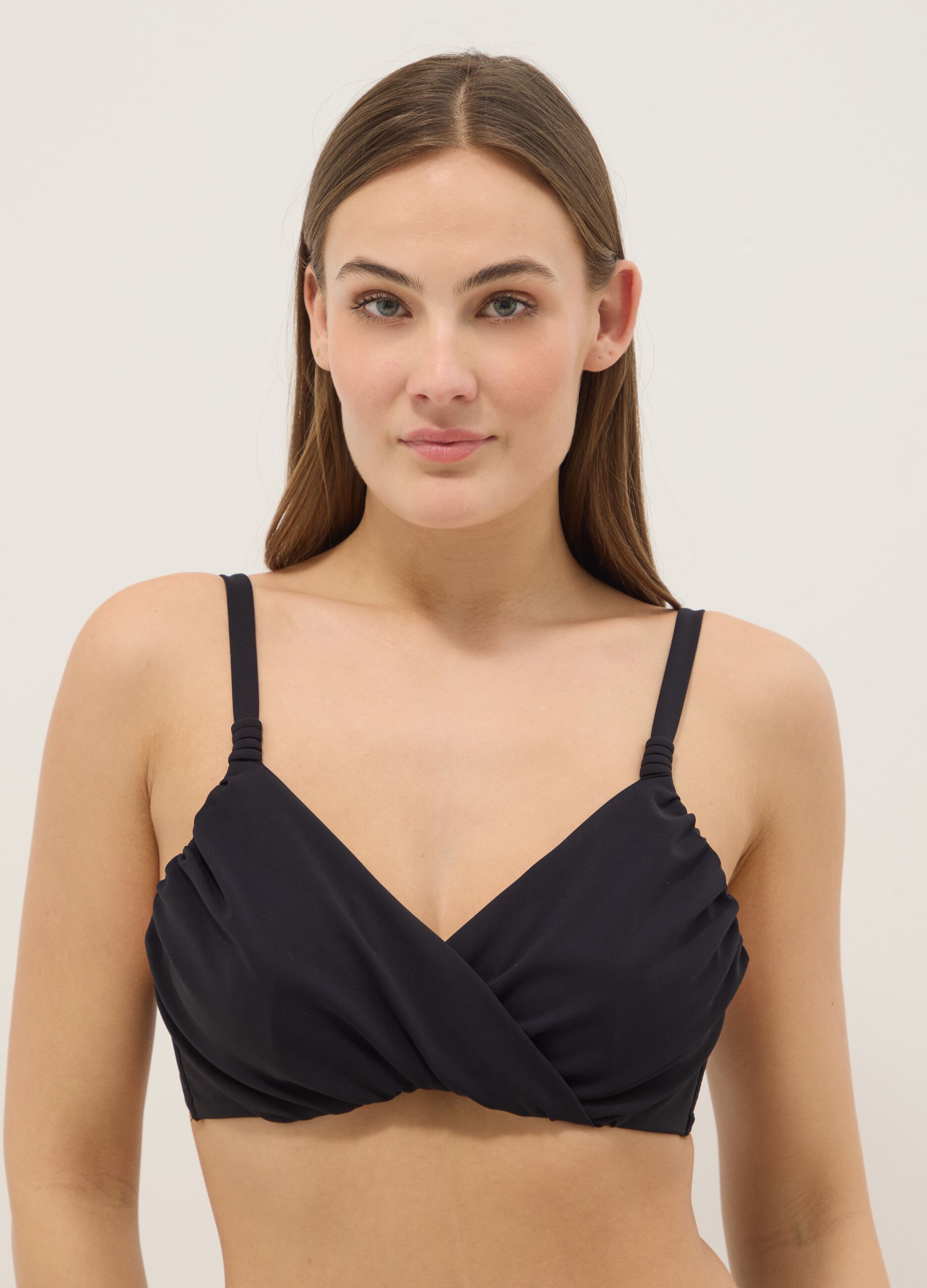 Black bikini top in stretch fabric with shaping effect