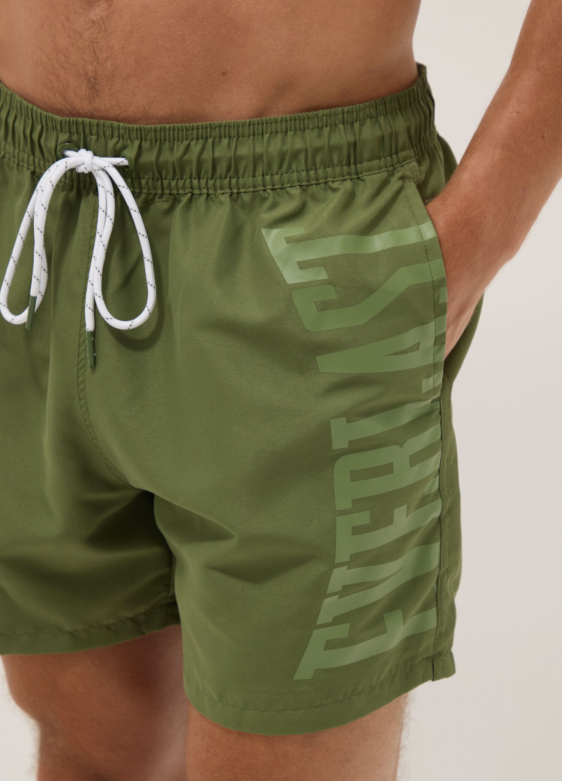Green swim shorts with contrast drawstring