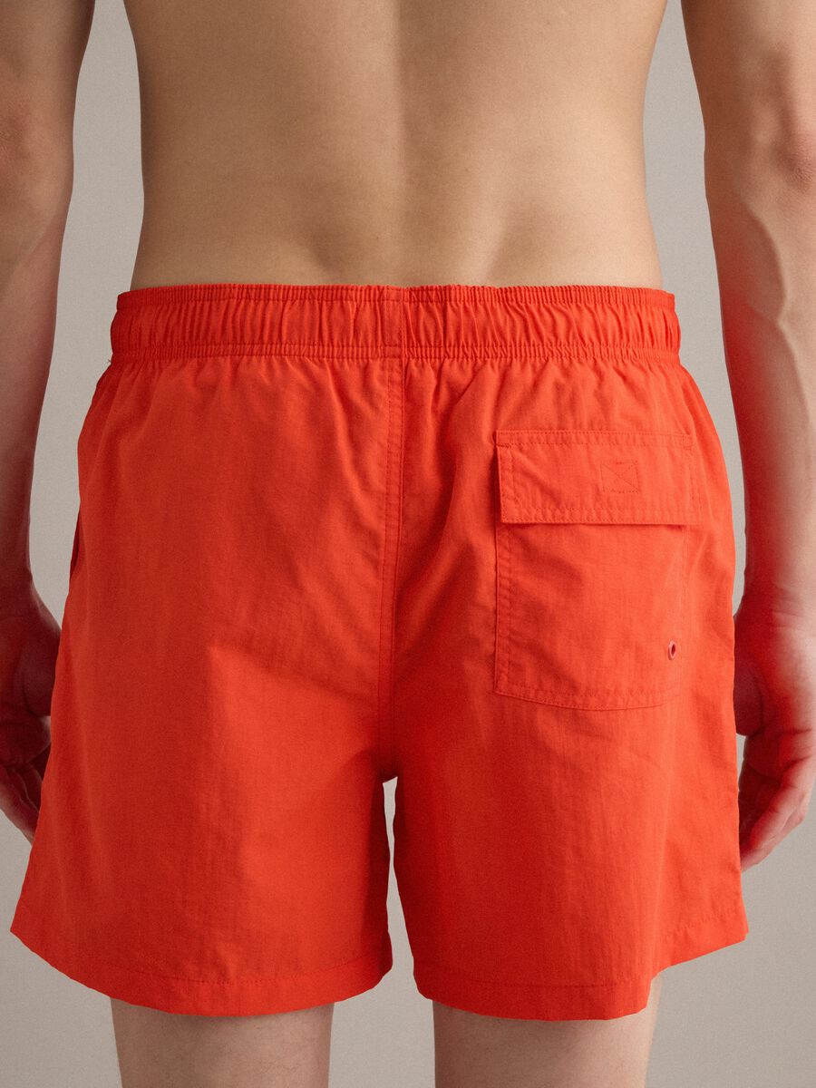 Orange swim shorts with elasticated waistband and drawstring_4