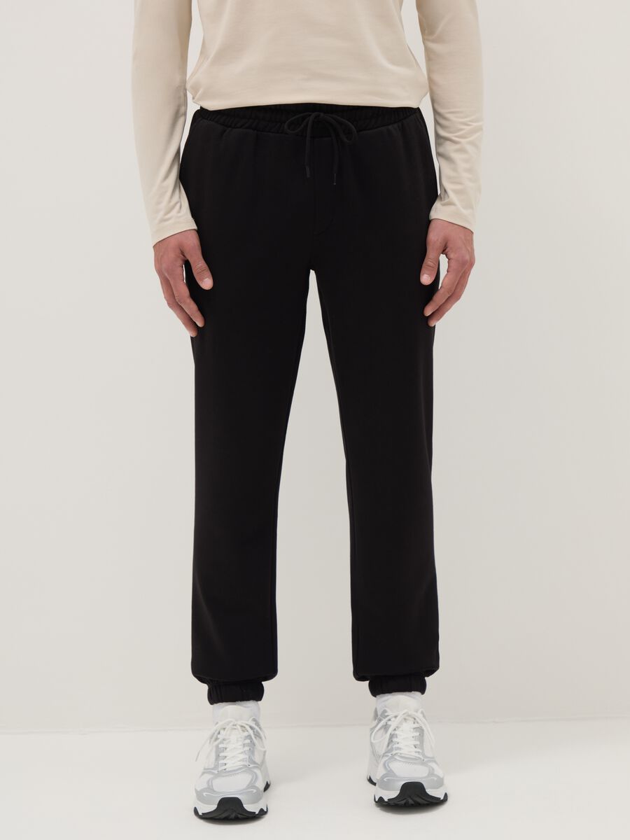 Black cotton blend regular fit jogger trousers_1