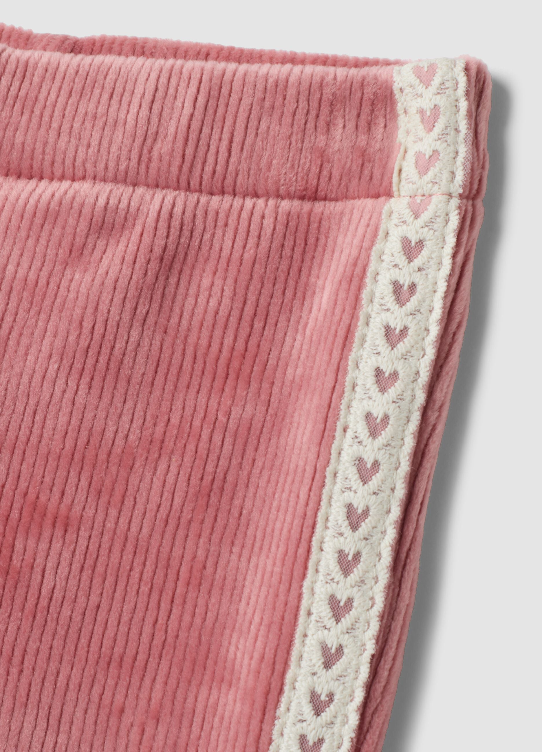 Pantaloni flare rosa in tessuto elasticizzato a costine