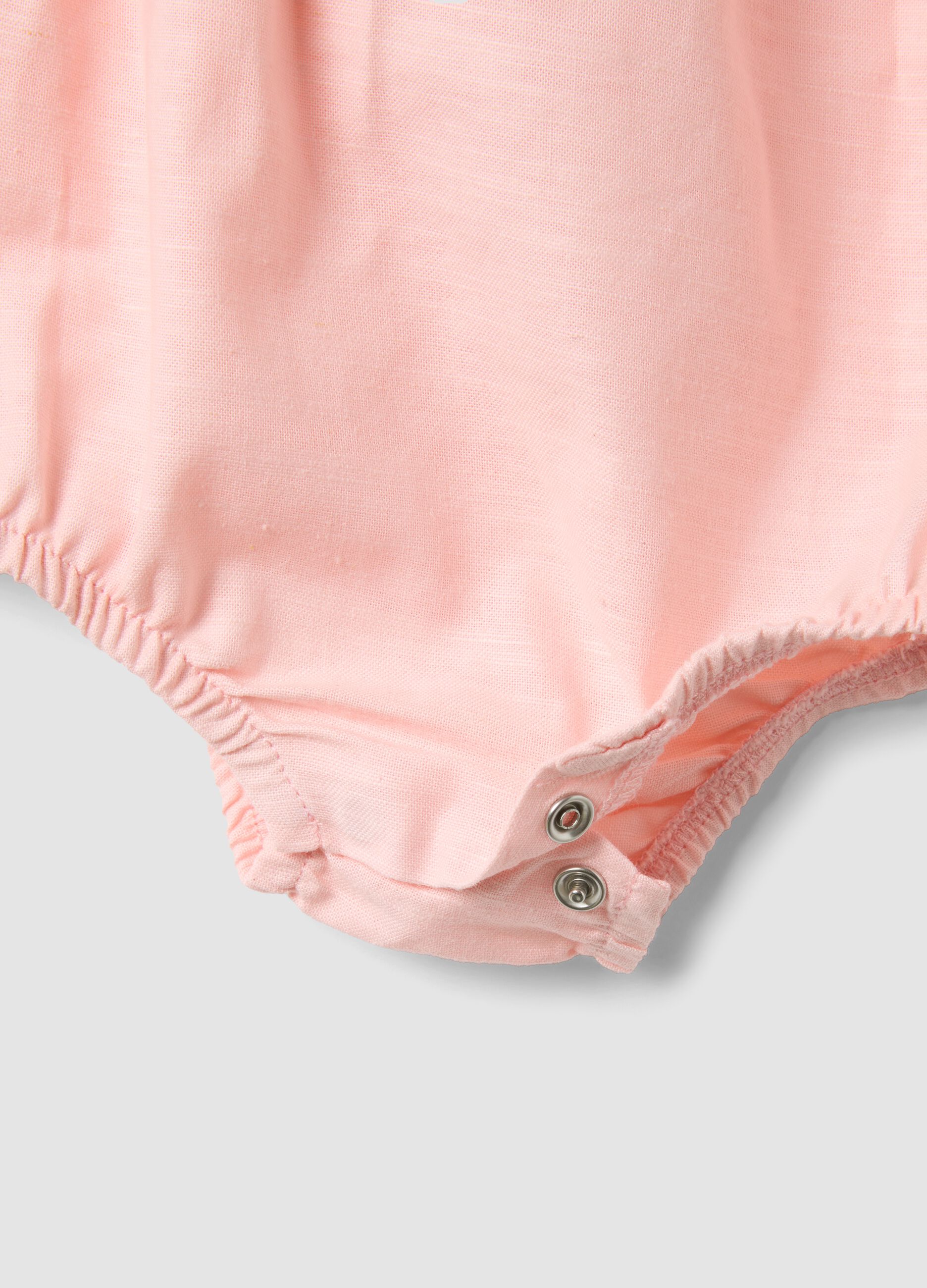 Pink and white organic cotton romper with classic collar