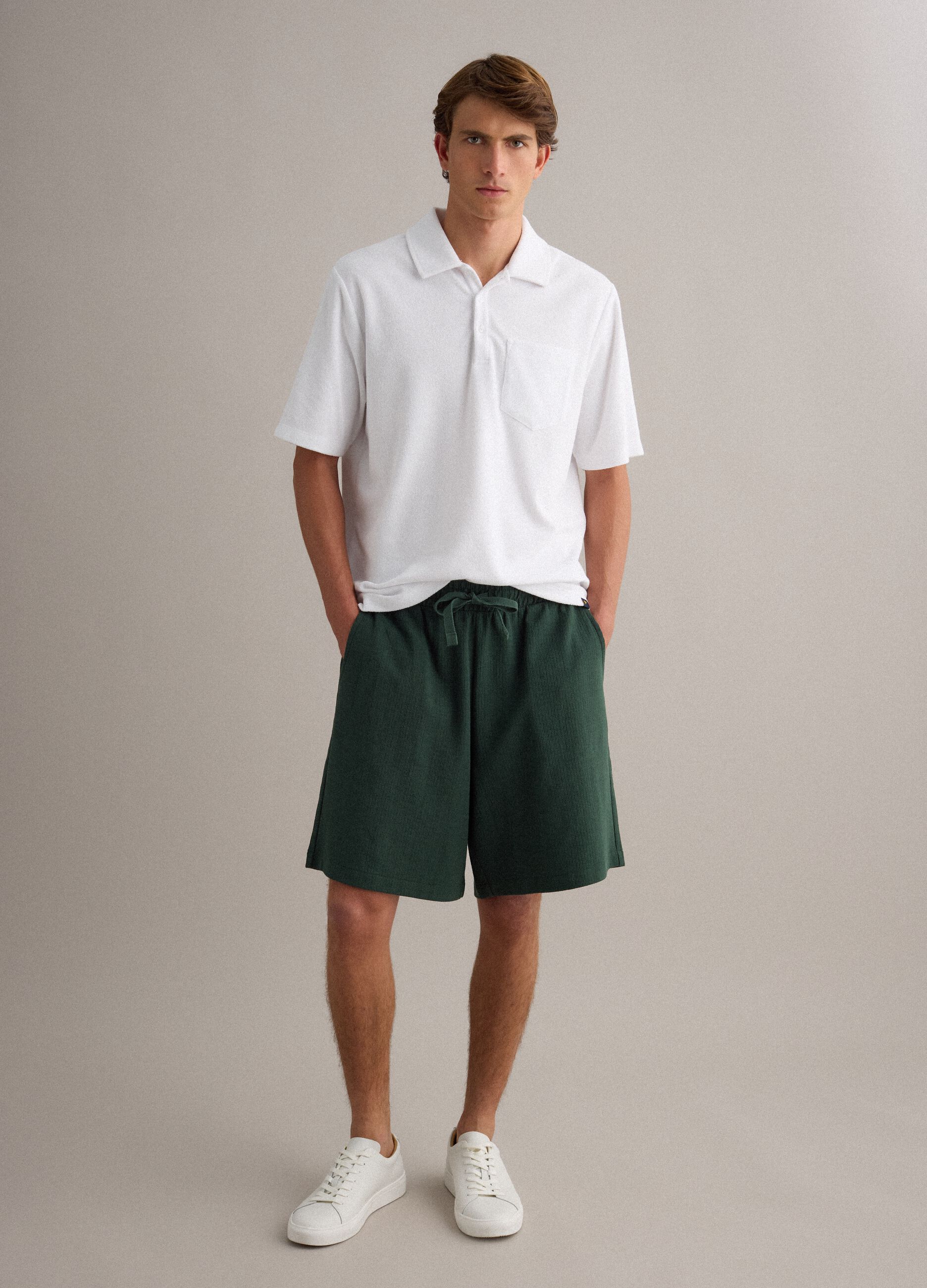 Green cotton-blend jogger shorts with drawstring, relaxed fit