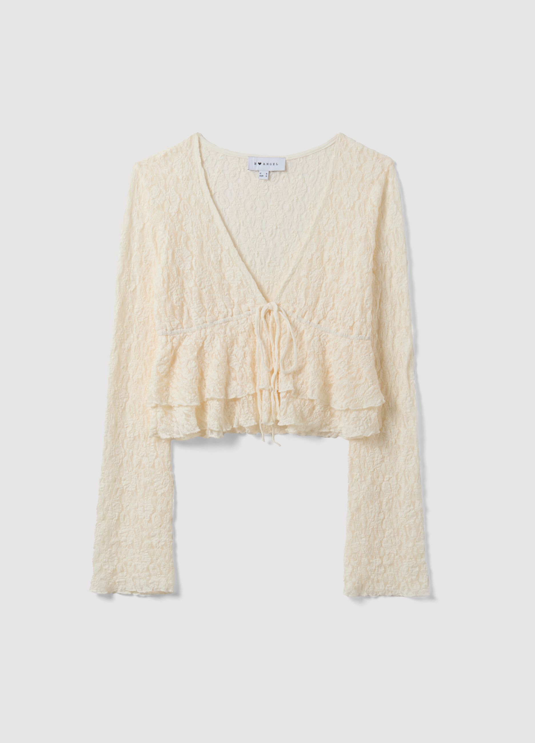 White stretch fabric top with deep V-neck and ruffle hem