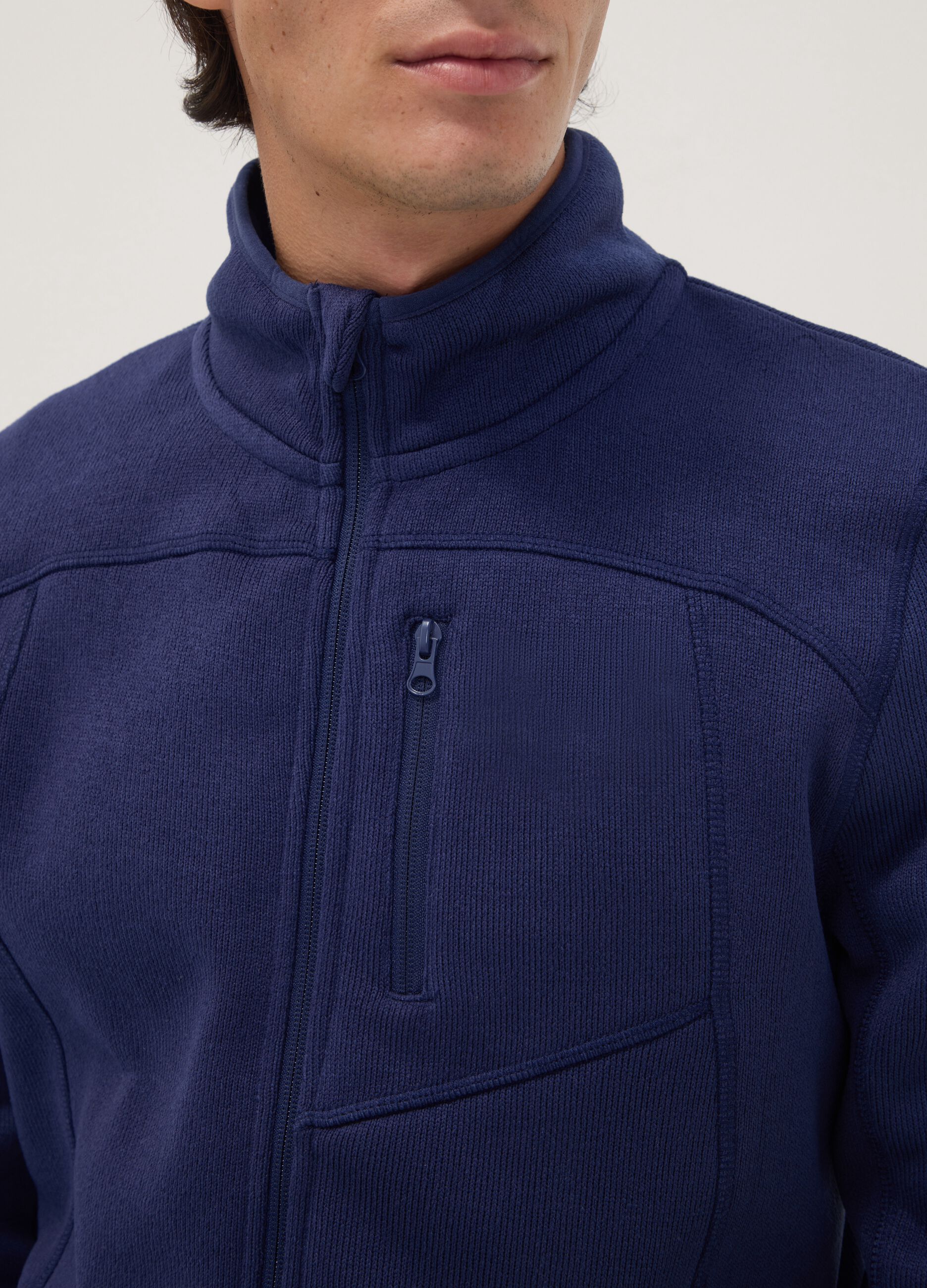 Blue full-zip sweatshirt with high neck and logo