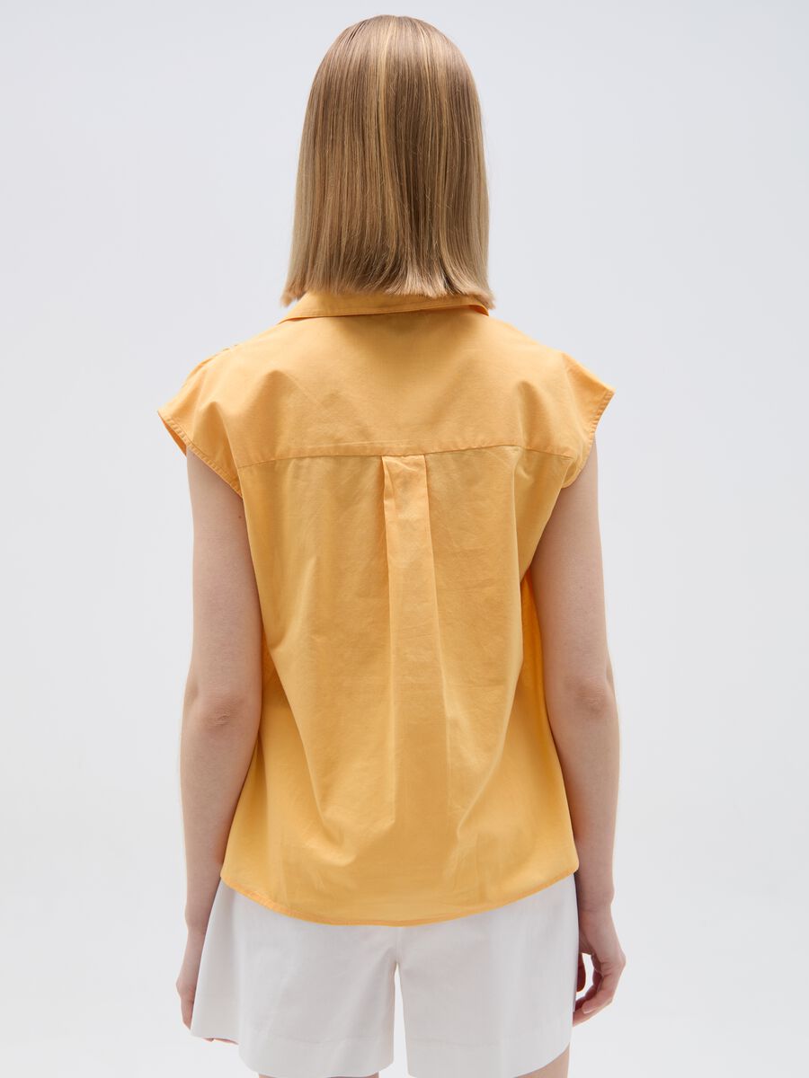 Sleeveless blouse with polo neck_1