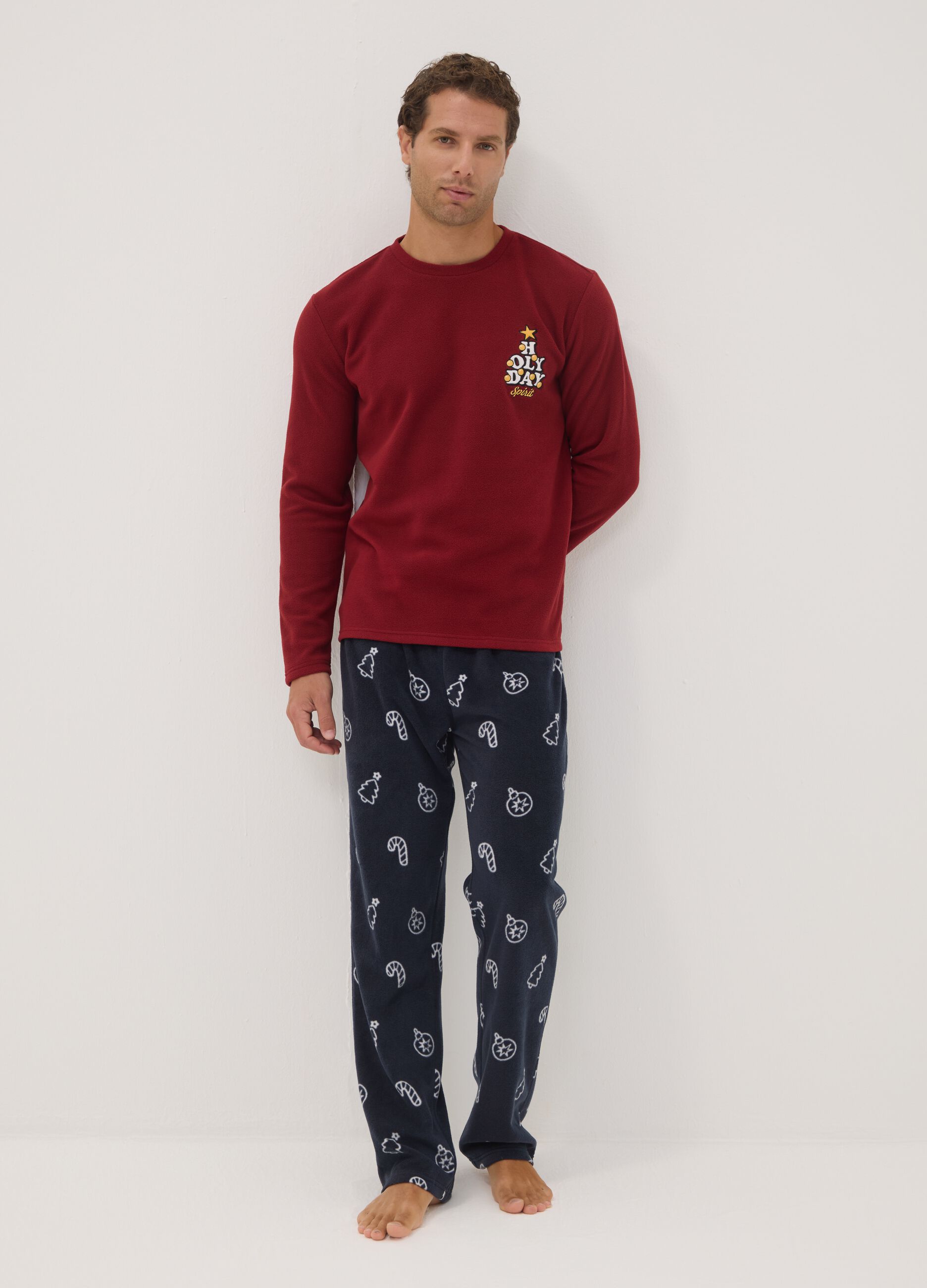 Long red pyjama set with crew neck top and patterned trousers