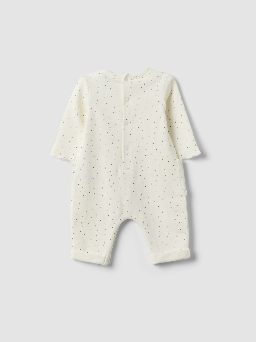 White organic cotton baby romper with buttons and pattern_1