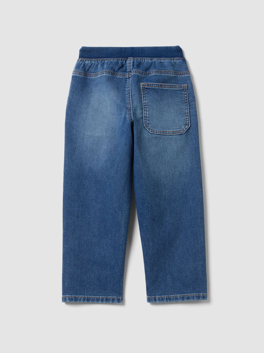 Blue denim joggers in stretch cotton with elasticated waistband for boys_1
