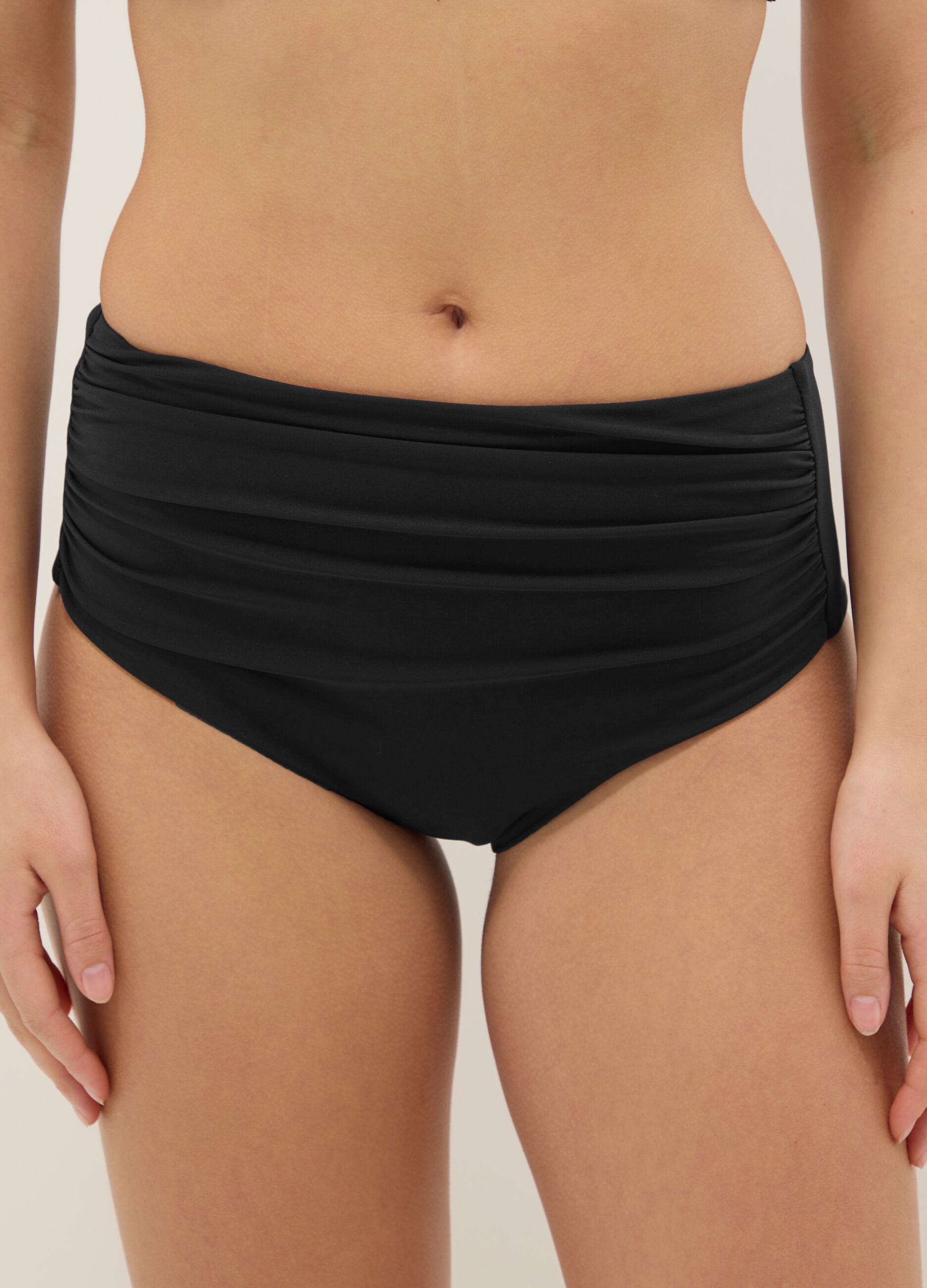 Black high-waisted stretch bikini bottoms with shaping effect