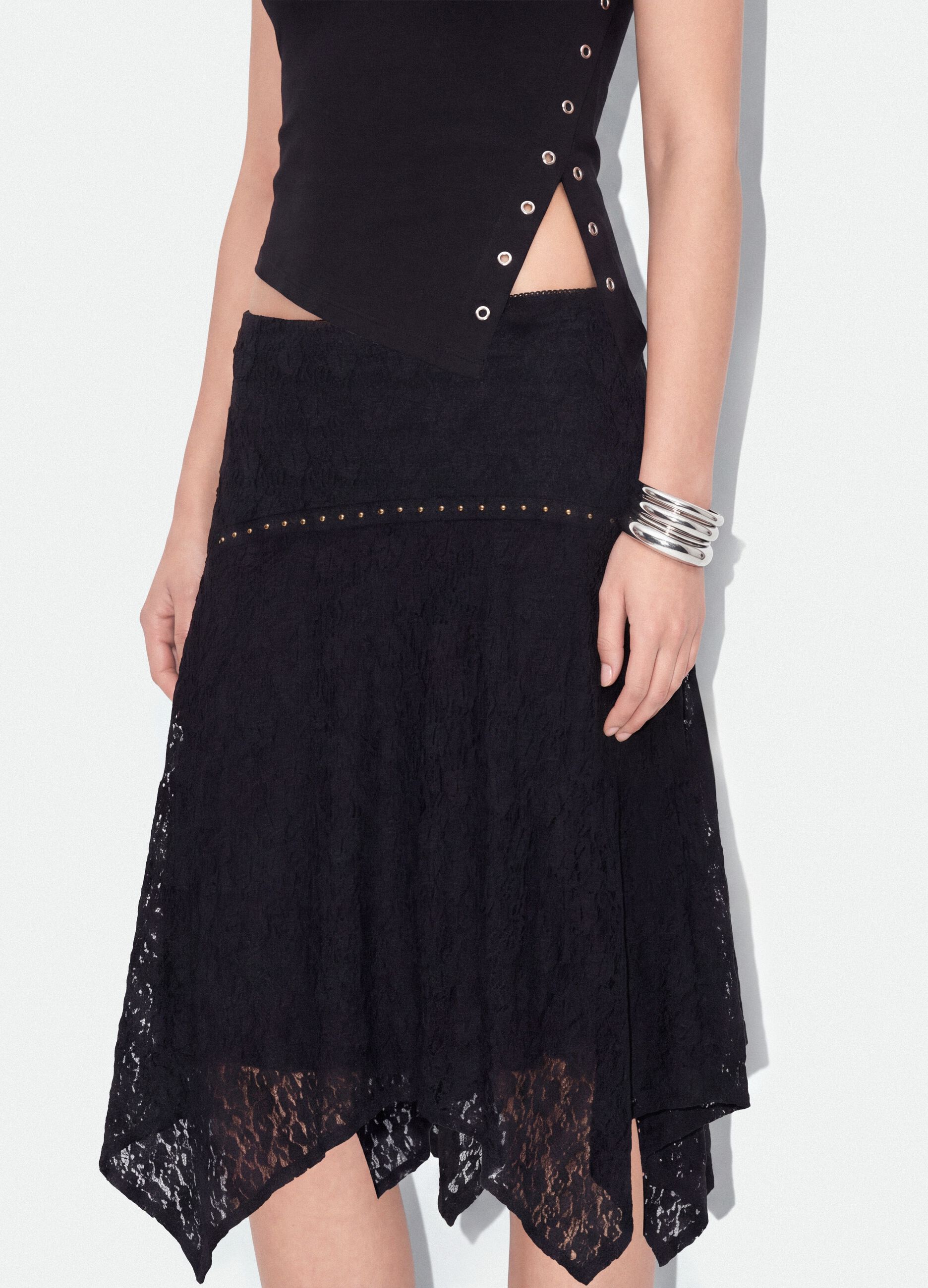 Black stretch skirt with asymmetric lace hem