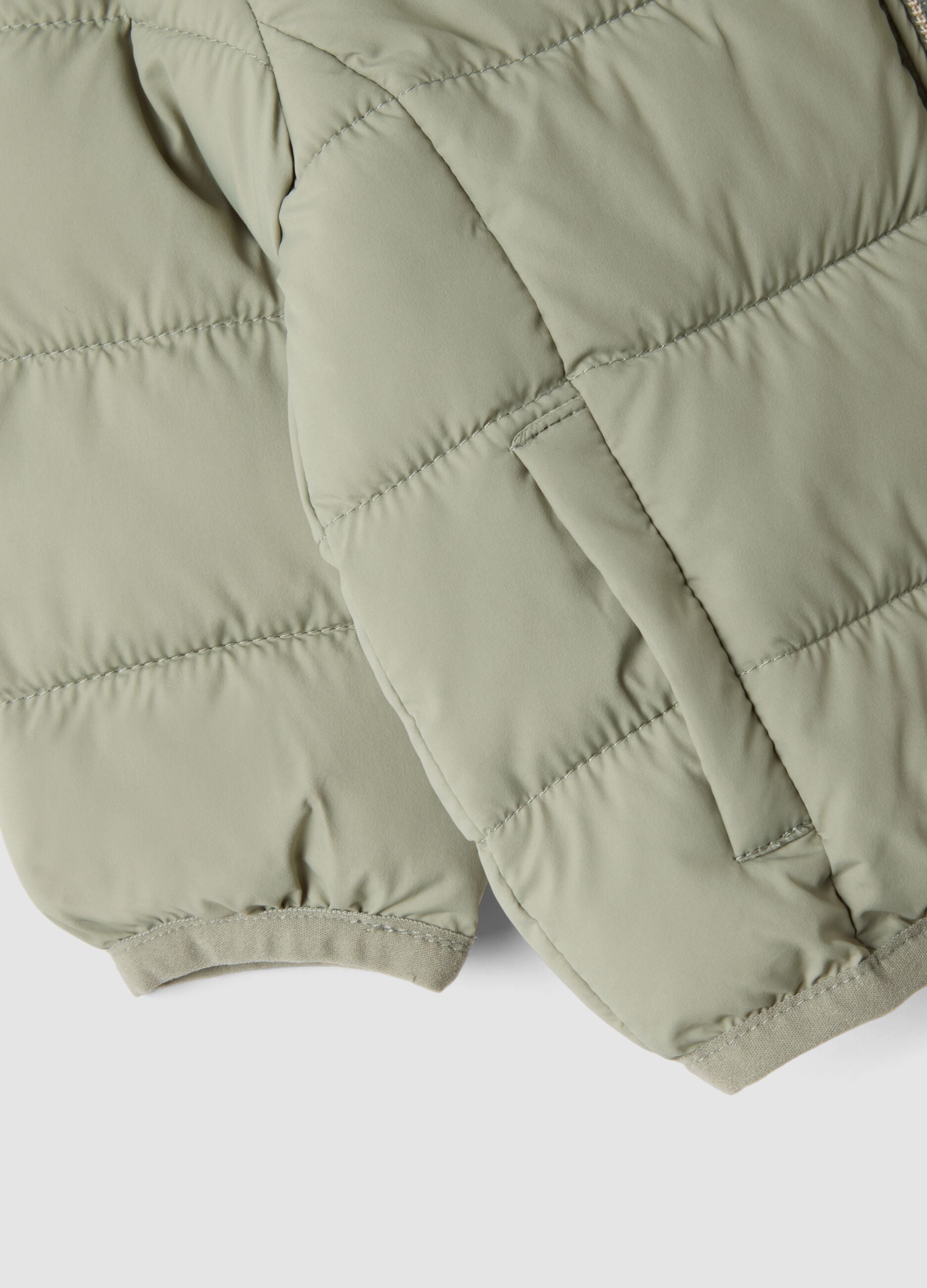 Green padded ultralight jacket with hood and zip for baby