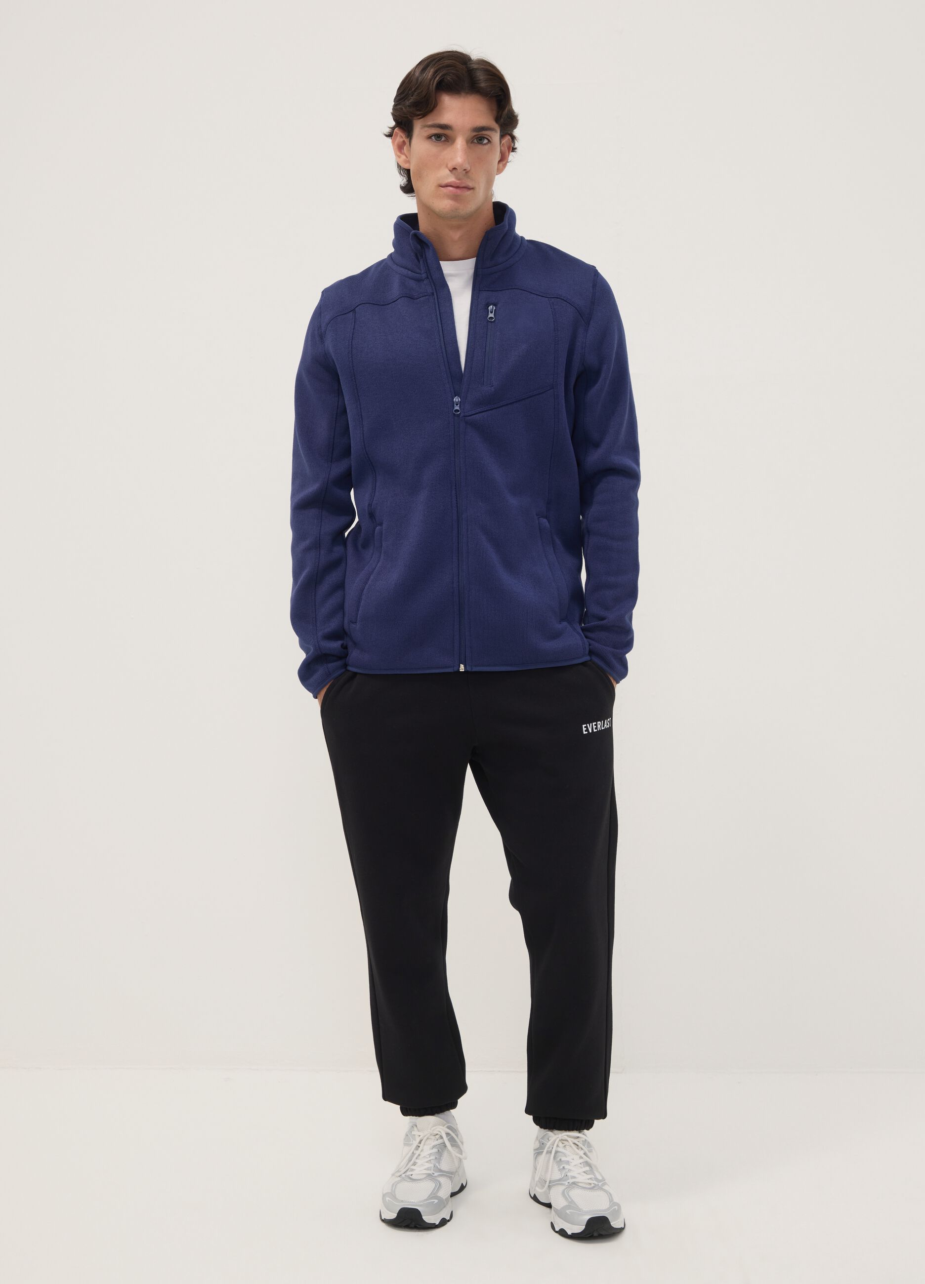 Blue full-zip sweatshirt with high neck and logo